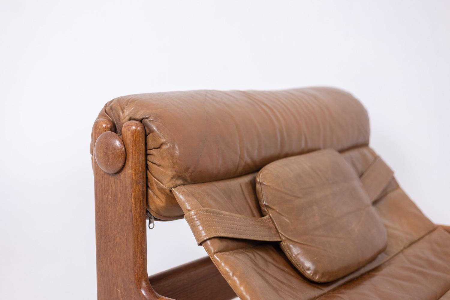 Danois Chaise longue et ottoman en orme blond et cuir. 1970s en vente