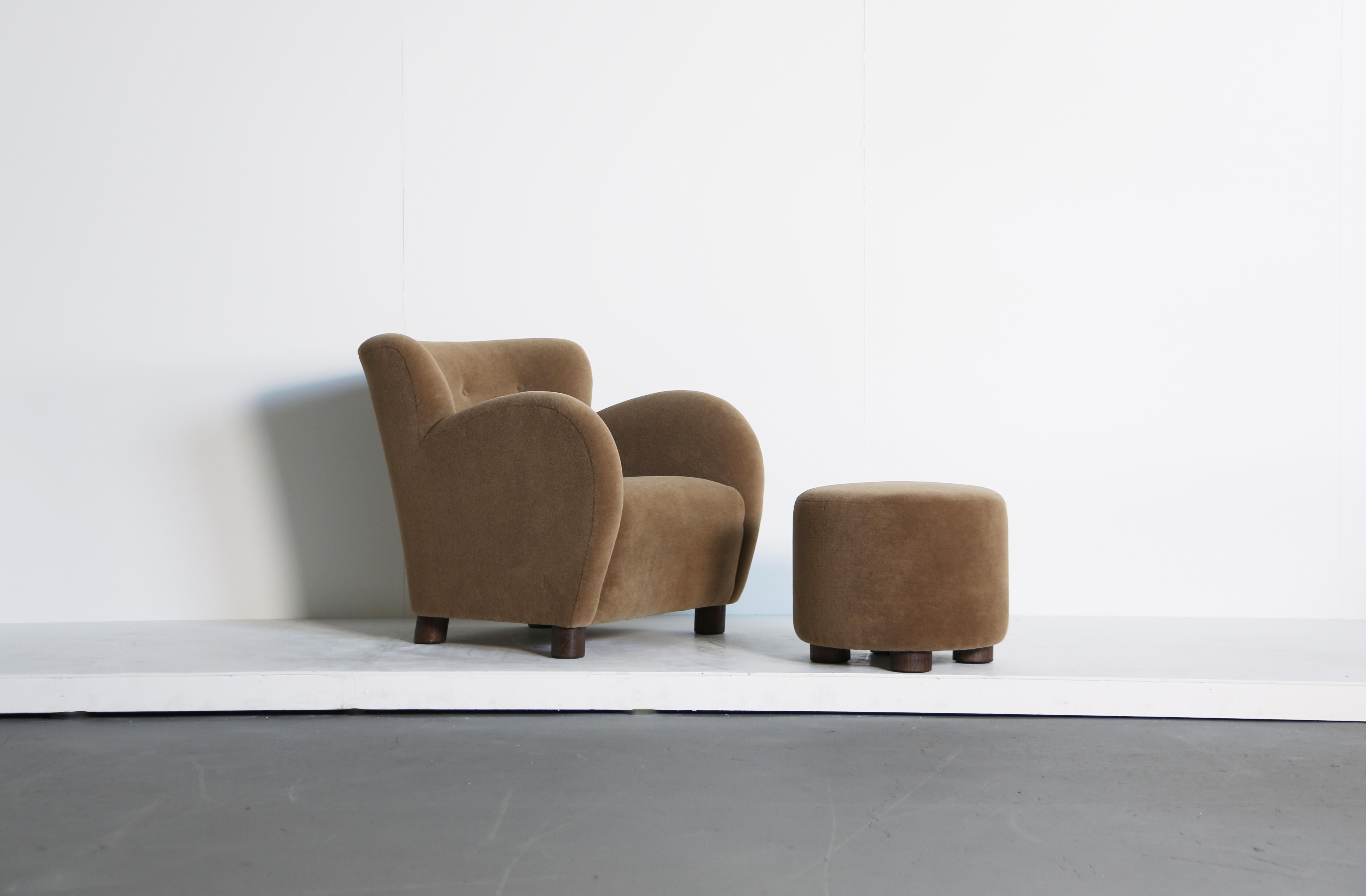 A superb modern round arm armchair and ottoman. Handmade beech frames, sprung seat and newly upholstered in a premium, golden brown, soft, pure alpaca wool fabric with solid oak feet.  The displayes price is for a single chair and single ottoman