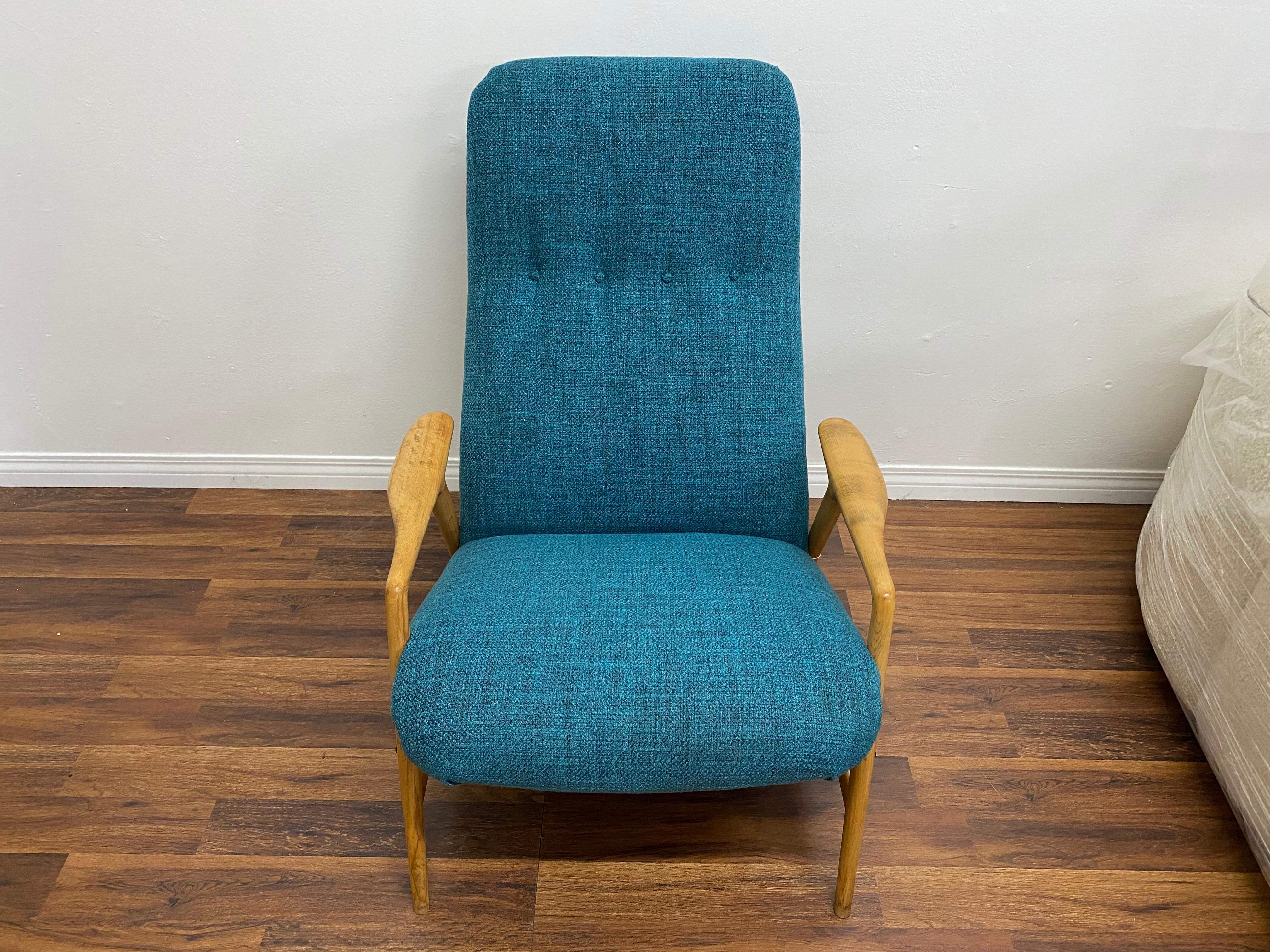 Lounge chair with ottoman by Alf Svensson for DUX of Sweden, circa 1950s. Newly upholstered in a new tweed fabric. The chair features a high back and Dual angle adjustment setting. Solid sculptural birch frame with brass accents. The birch frames
