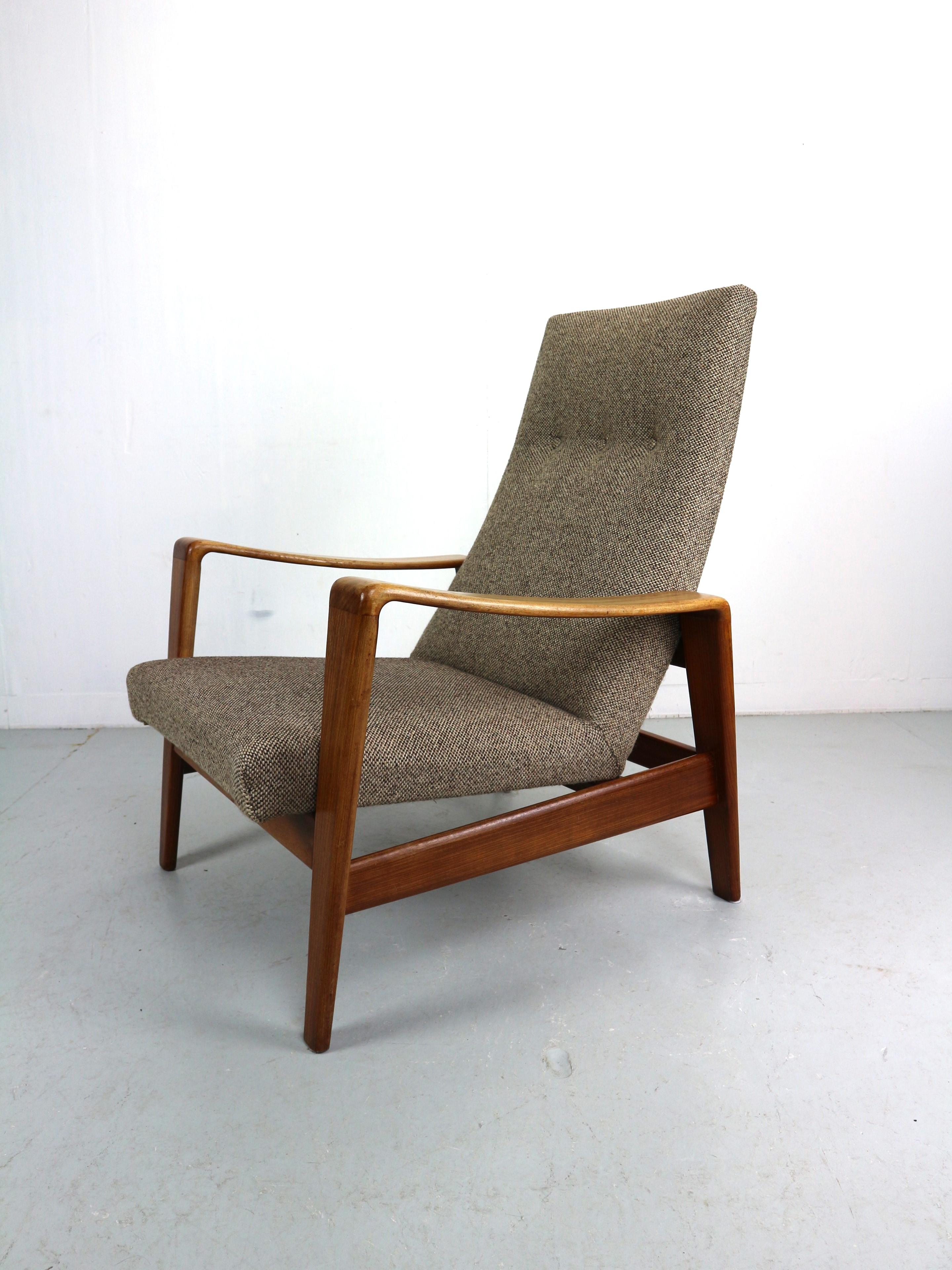 Easy chair designed by Arne Wahl Iversen, manufactured by Komfort Denmark 1960. These chairs have solid teak wooden frames and original light brown upholstery. These organic and dynamic shaped chairs look great in every livingroom. Comfortable easy