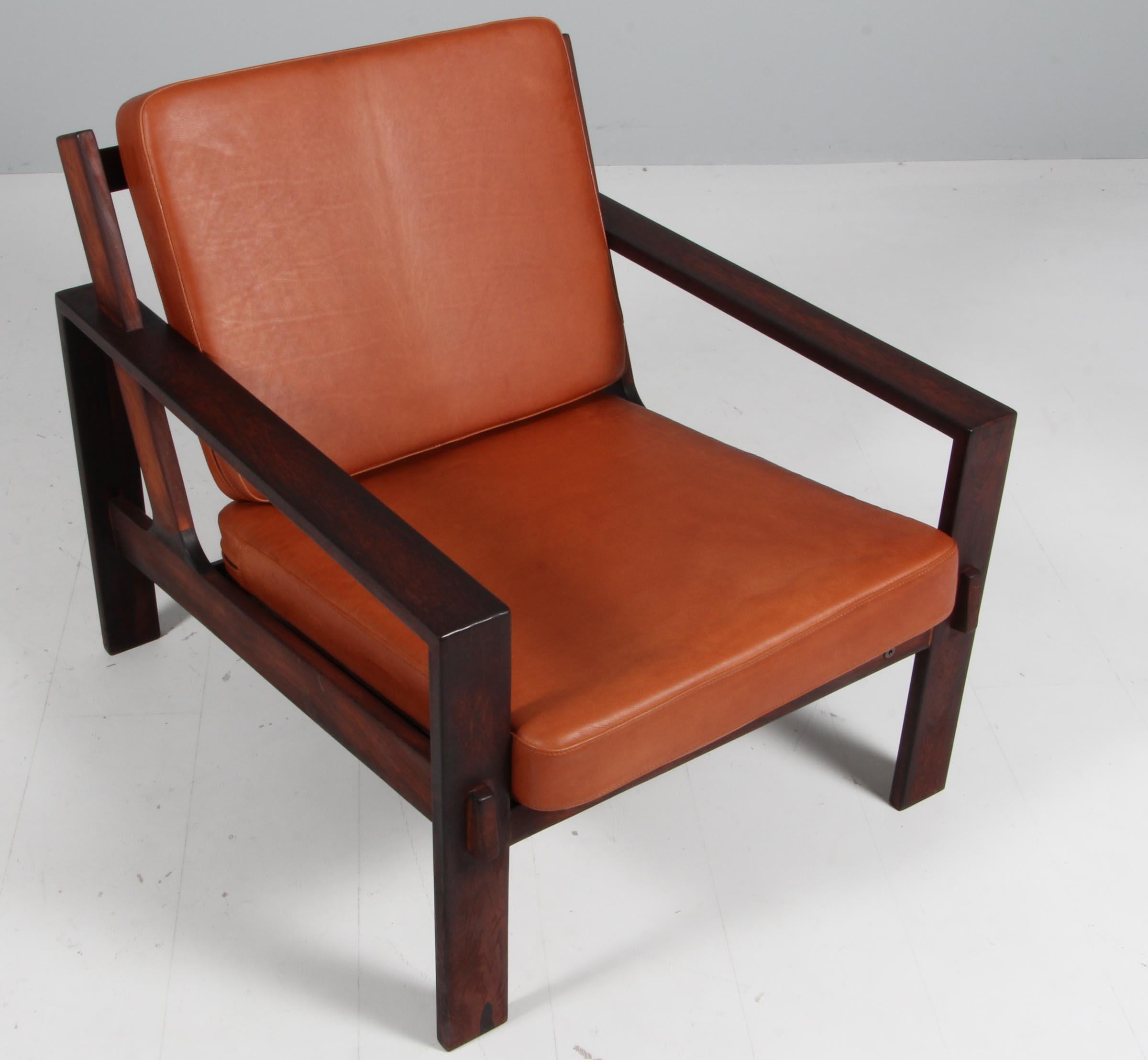 Lounge chair by Esko Pajamies for Asko, made in Finland in the 1970s. New upholstered with walnut aniline leather. Frame of rosewood.