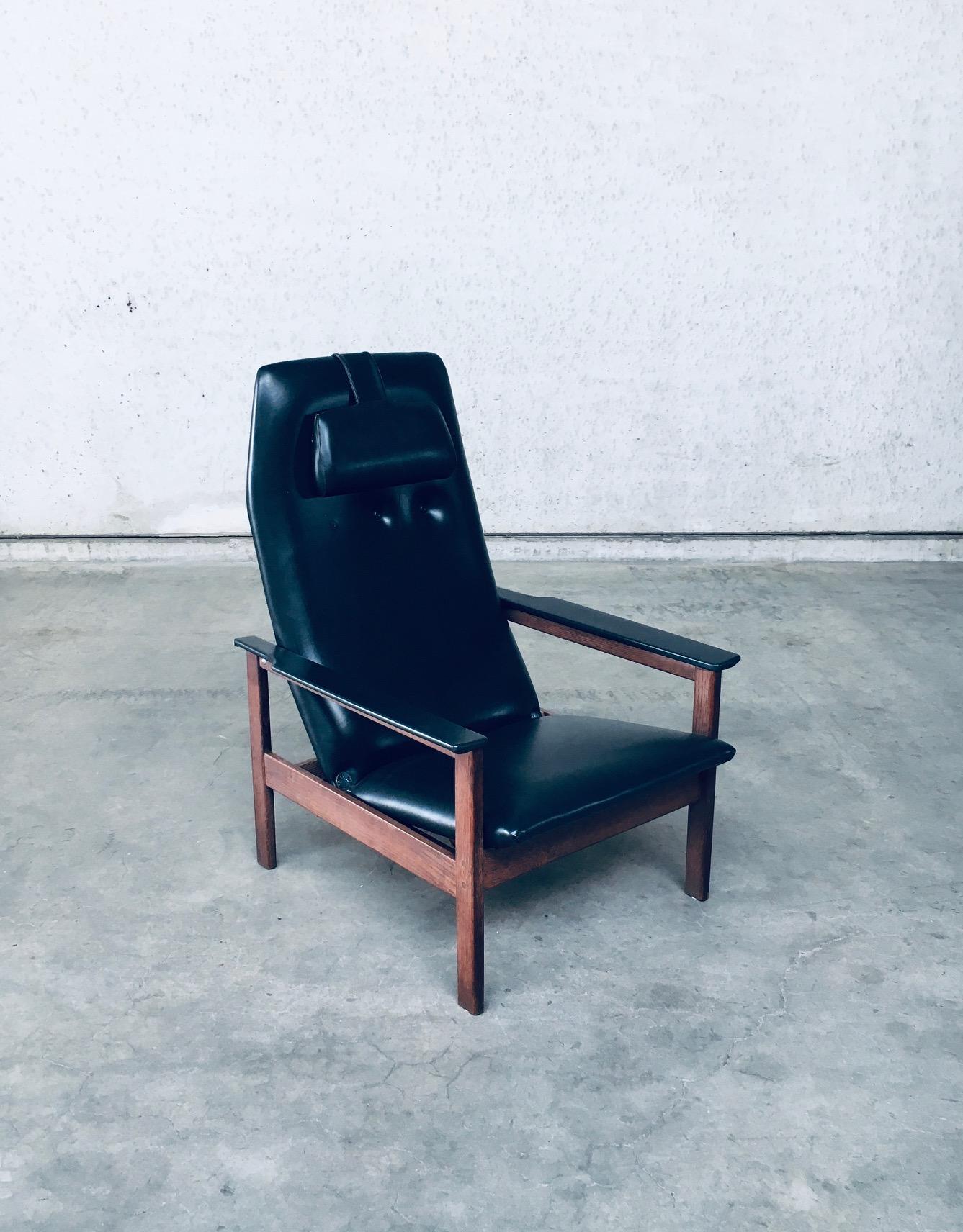 Vintage Midcentury Modern Belgian Design Lounge Relax Chair by Georges Van Rijck for Beaufort. Made in Belgium, 1960's. Recliner arm chair with it's original head rest cushion.. Wenge wood frame with faux leather covered seat and armrests. The