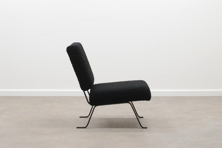 Lounge chair by Hein Salomonson for AP Originals (A. Polak). This are early editions from the 50s. Bare metal frames with reupholstered seat and back in black teddy fabric.