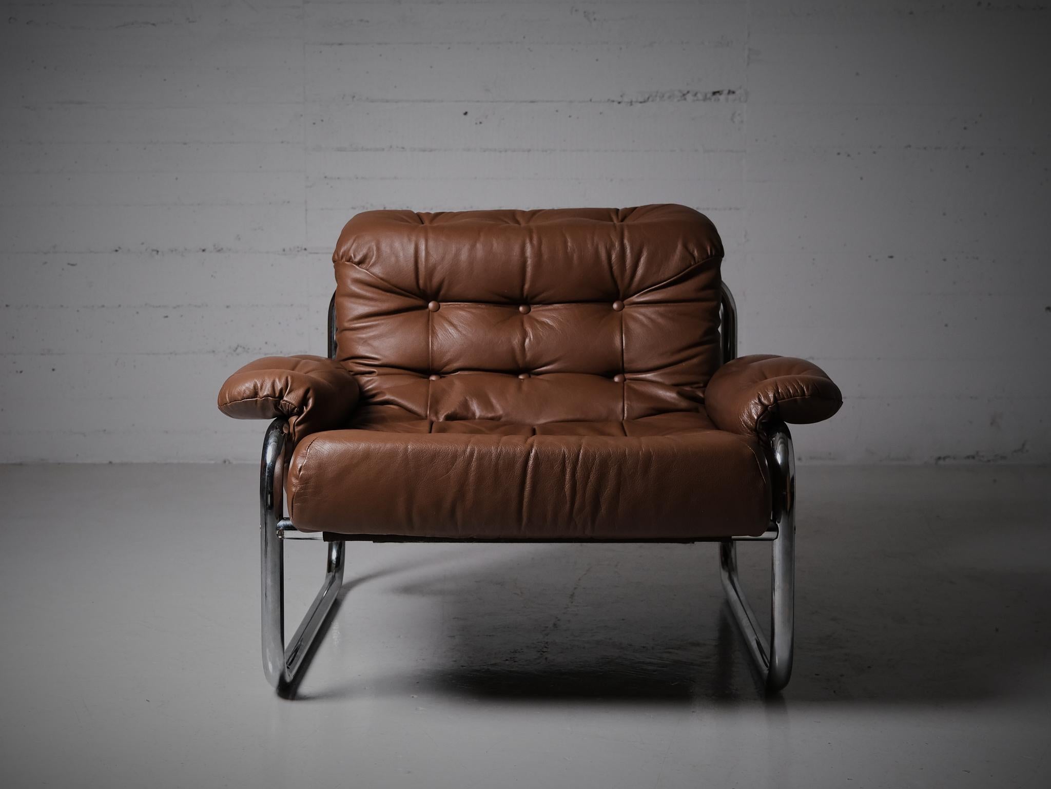 Great lounge chair designed by John Bertil Häggström for IKEA, Sweden, during the 1970s.

Made in chrome with leather cushions.

Whole group available in our store with a three-seater and two-seater sofa.