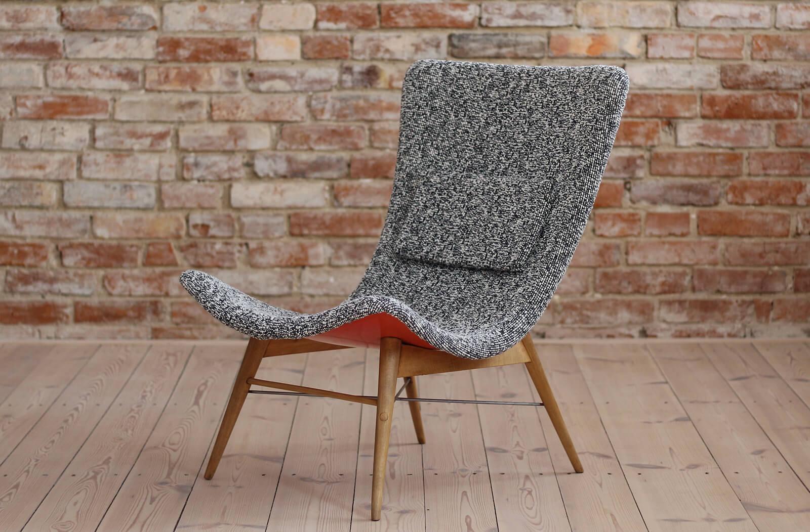 Lounge chair by Miroslav Navratil, manufactured in former Czechoslovakia by Cesky Nabytek, 1959. Original wooden base, fiberglass shell seating. The chair is newly upholstered with a high quality fabric from Sahco brand (41% cotton 30% polyacrylic