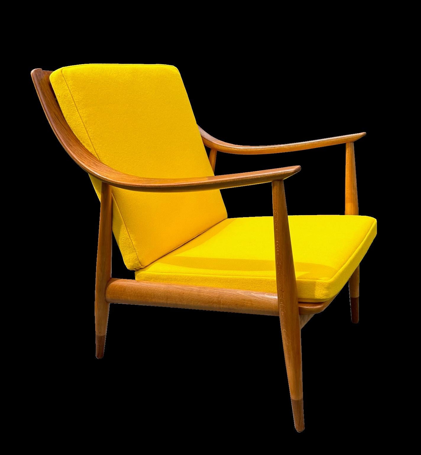An original version of this very stylish lounge chair by Hvidt & Molgaard-Nielsen, the frame in great condition, and the covers freshly recovered in best quality wool fabric in the original colour.