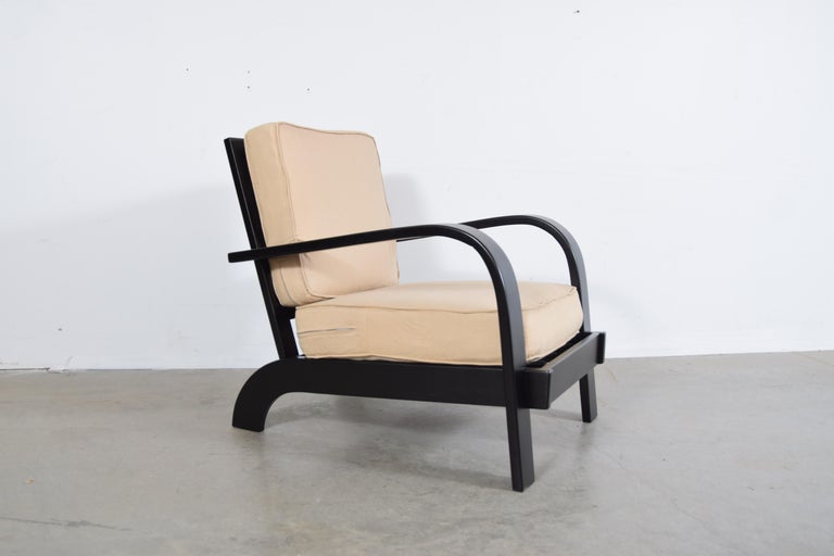 Russel Wright for Conant ball lounge chair, circa 1945. Chair is in new black lacquer. The cushions are covered in what appears to be the original barkcloth, but we can't confirm that it is, in fact, the original. It is, however, in very good