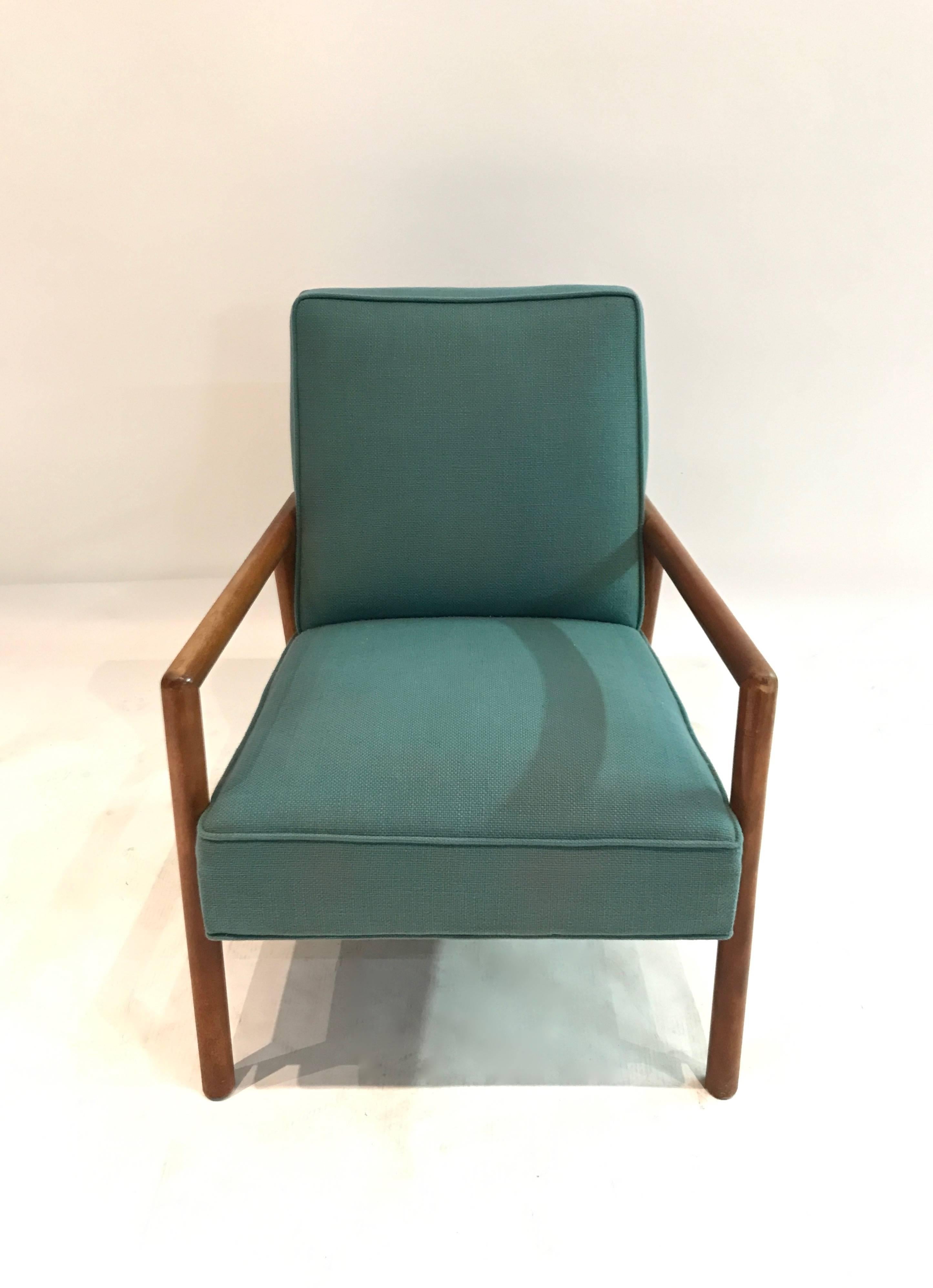 Single lounge chair designed by Robsjohn-Gibbings in very good, original condition with teal colored fabric upholstery.