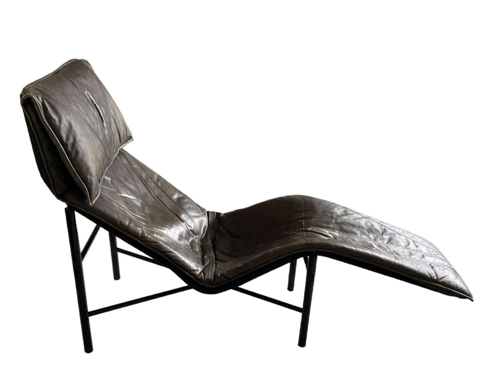 Comfortable lounge chair with a removable brown leather top on a black iron base. Designed by Tord  Björklund for Ikea.