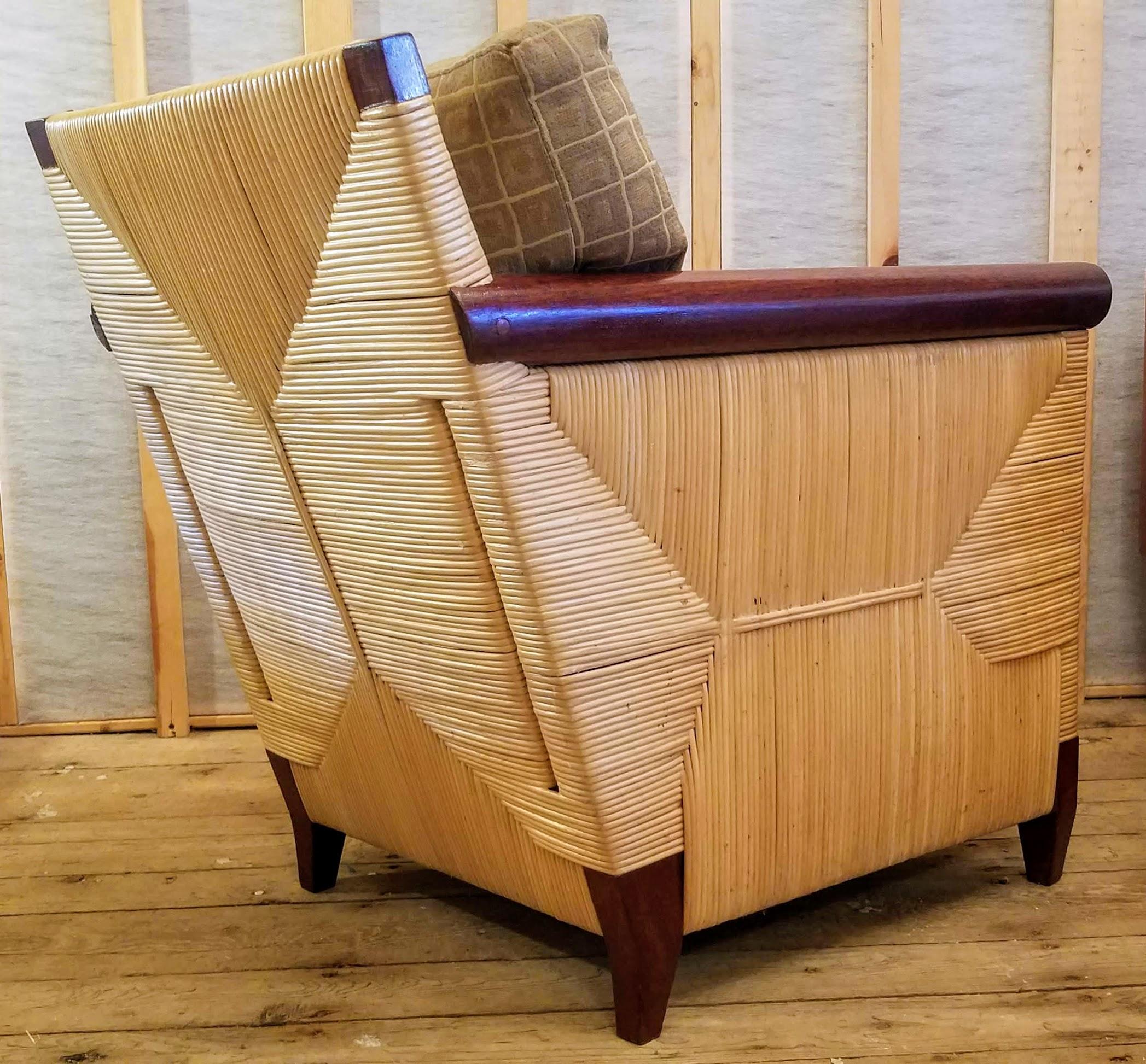 A stunning caned lounge chair from the limited production Merbau Collection designed by John Hutton (1947-2006) for Donghia, circa 1995. 
This particular series is scarce. 
John Hutton was the firm design director from 1978-1998 and was responsible