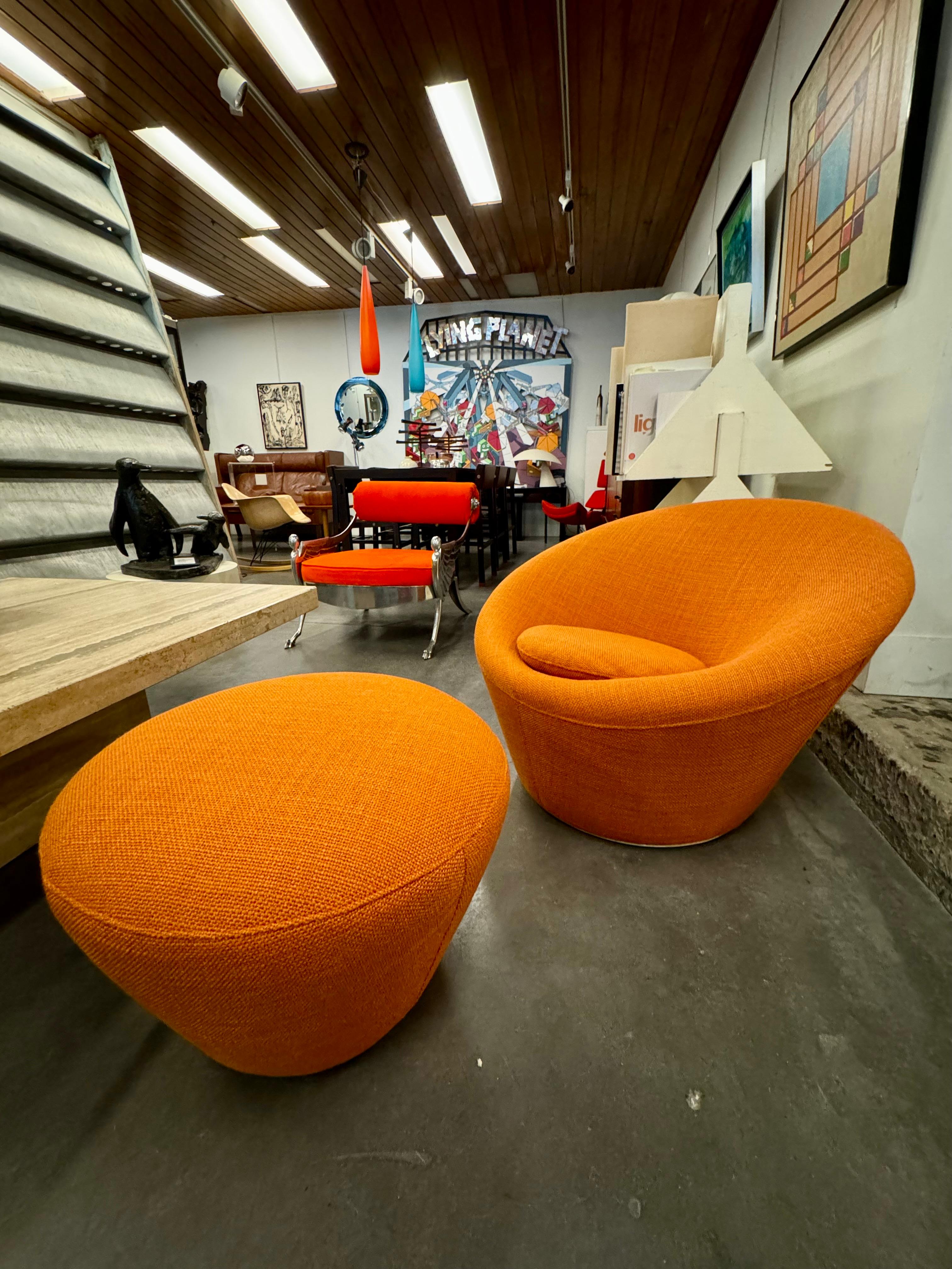 Pierre Paulin f560 called mushroom here is an Armchair and ottoman newly reupholstered in high-quality orange wool fabric 
The Mushroom Armchair, designed by the renowned French designer Pierre Paulin in 1959, exudes timeless elegance. Its