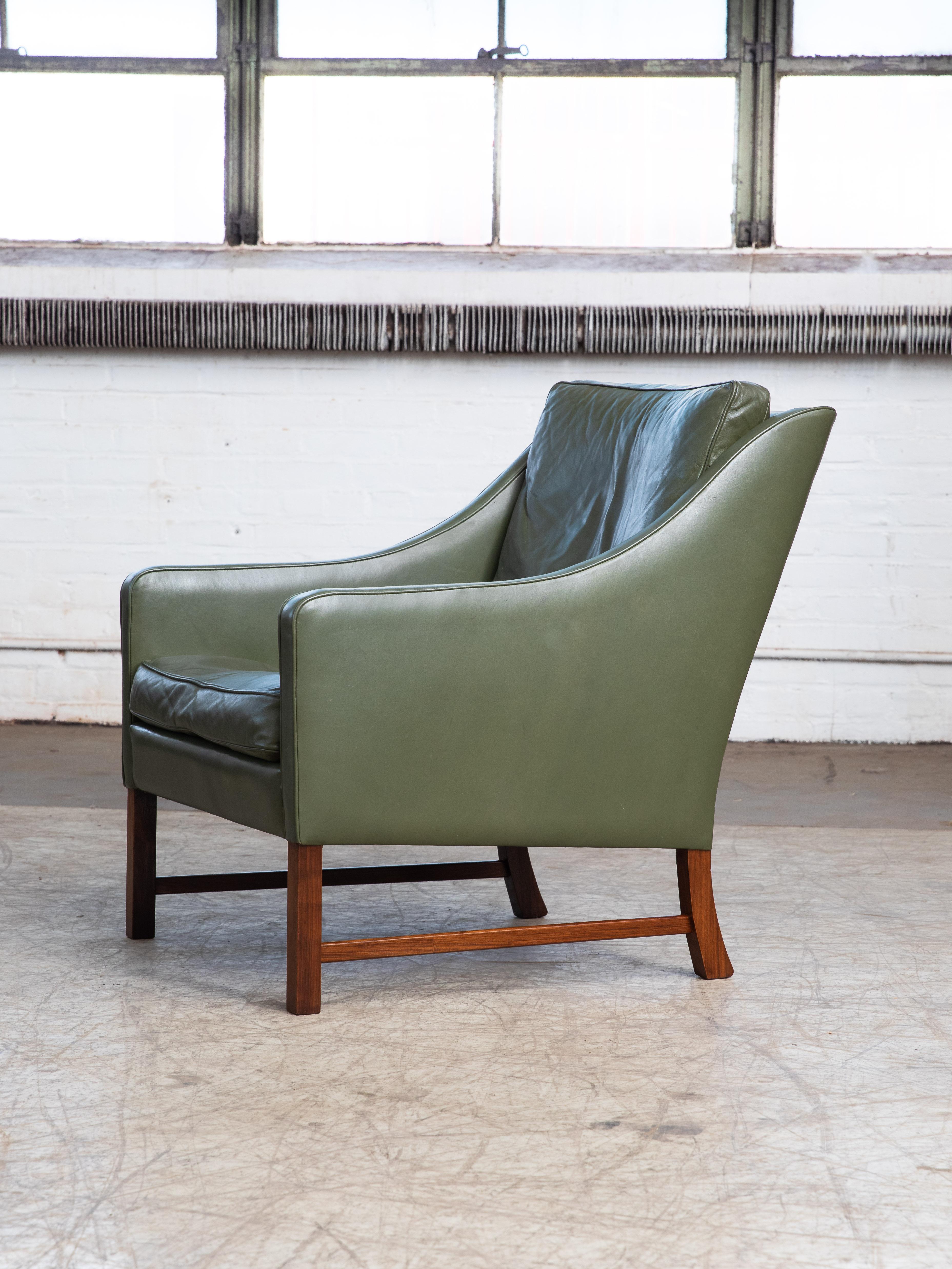 This very elegant lounge chair is unmarked but in terms of design bears many of the hallmarks of one of Norway's most iconic designers, Fredrik A. Kayser. This chair resembles Kayser's model 965H made by Vatne but with a more scooped out backrest.