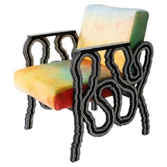 Lounge chair in wood with hand-dyed upholstered seat by Jason Andrew Turner