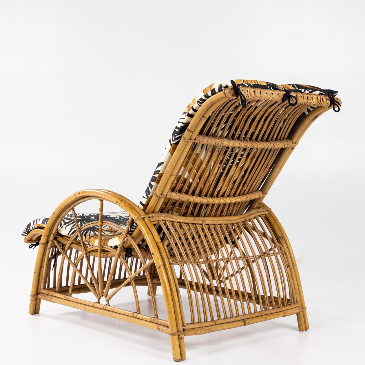 Lounge chair in woven bamboo with cushion in Vainui (colour: Coco) by Pierre Frey. Unknown maker