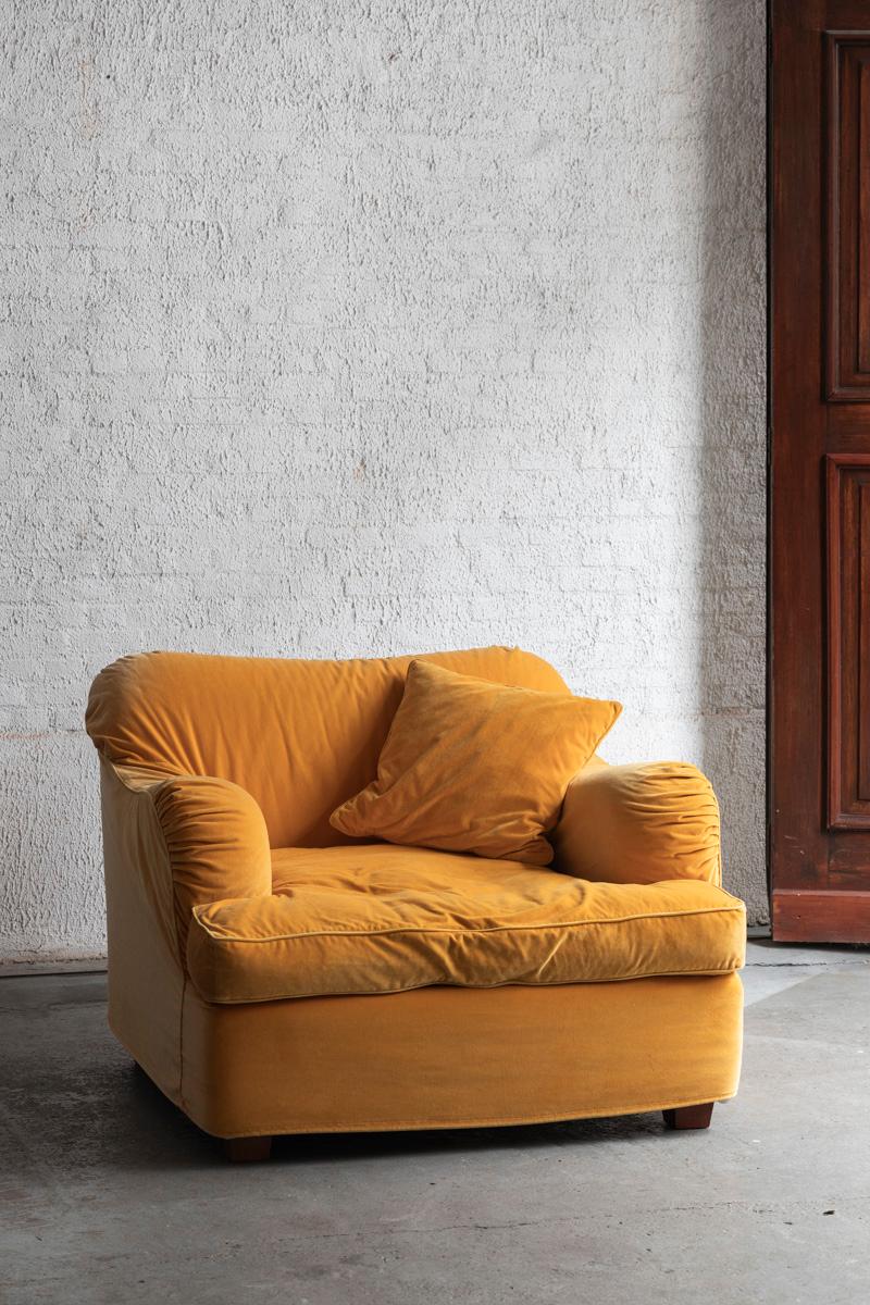 Lounge chair, produced in the 1980’s in a bright yellow velours. The happy colour and soft velours seating make this an ideal cuddle sofa or children’s favourite spot to read a bedtime story. The seating pillow and small pillow can be removed