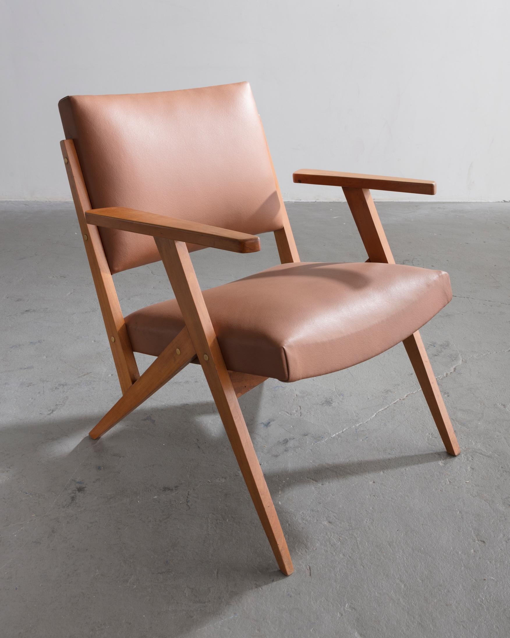 Lounge chair in caviona wood with tan leather upholstered seat and backrest. Designed by José Zanine Caldas, Brazil, circa 1960.