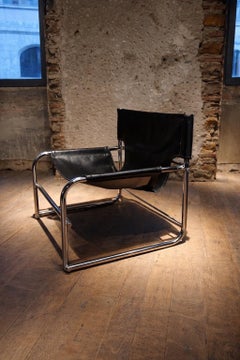 Lounge chair in leather by Rodney Kinsman