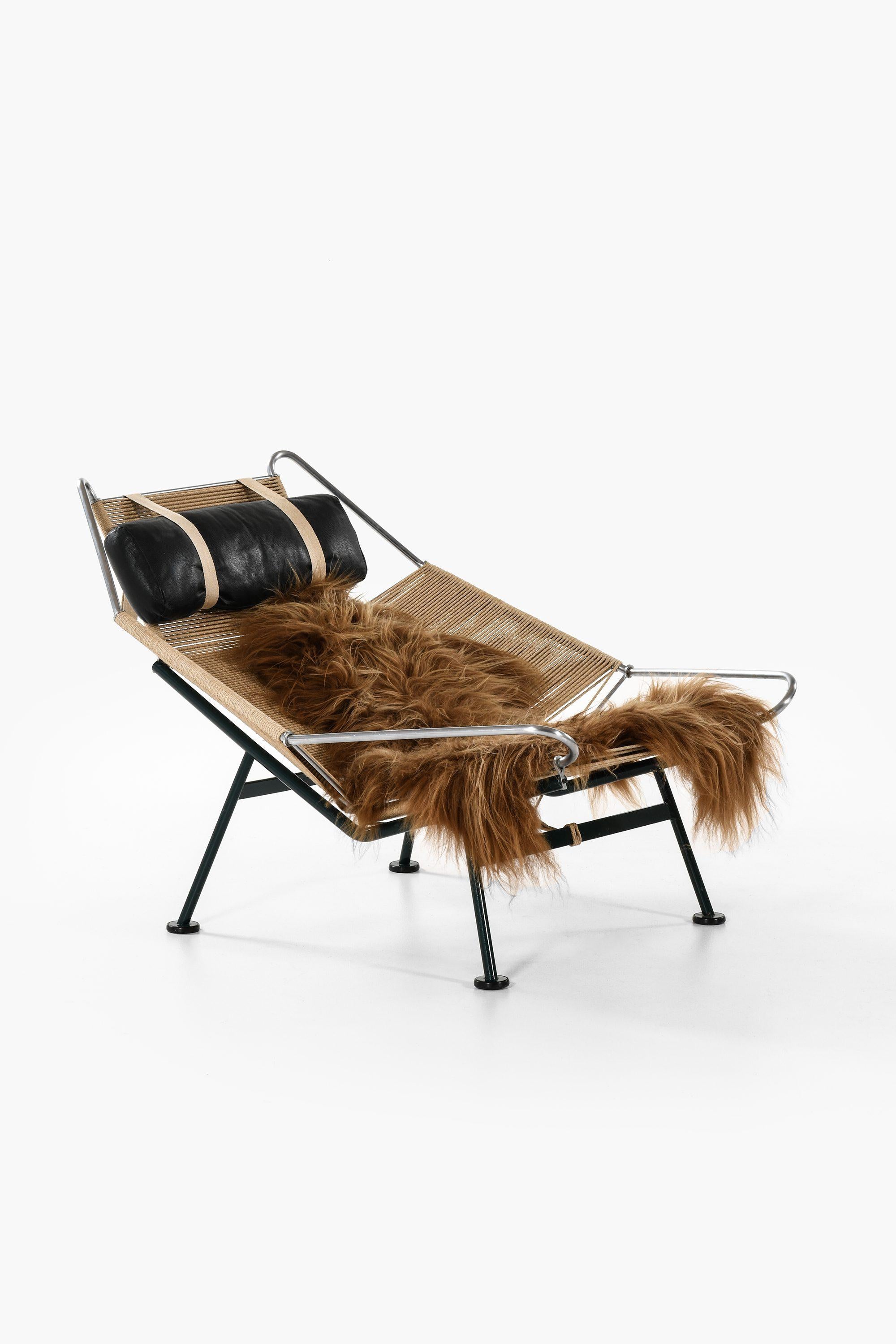 Scandinavian Modern Lounge Chair in Metal and Sheepskin by Hans Wegner, 1960s For Sale