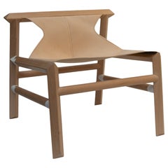 Lounge chair in natural leather and Patagonian wood