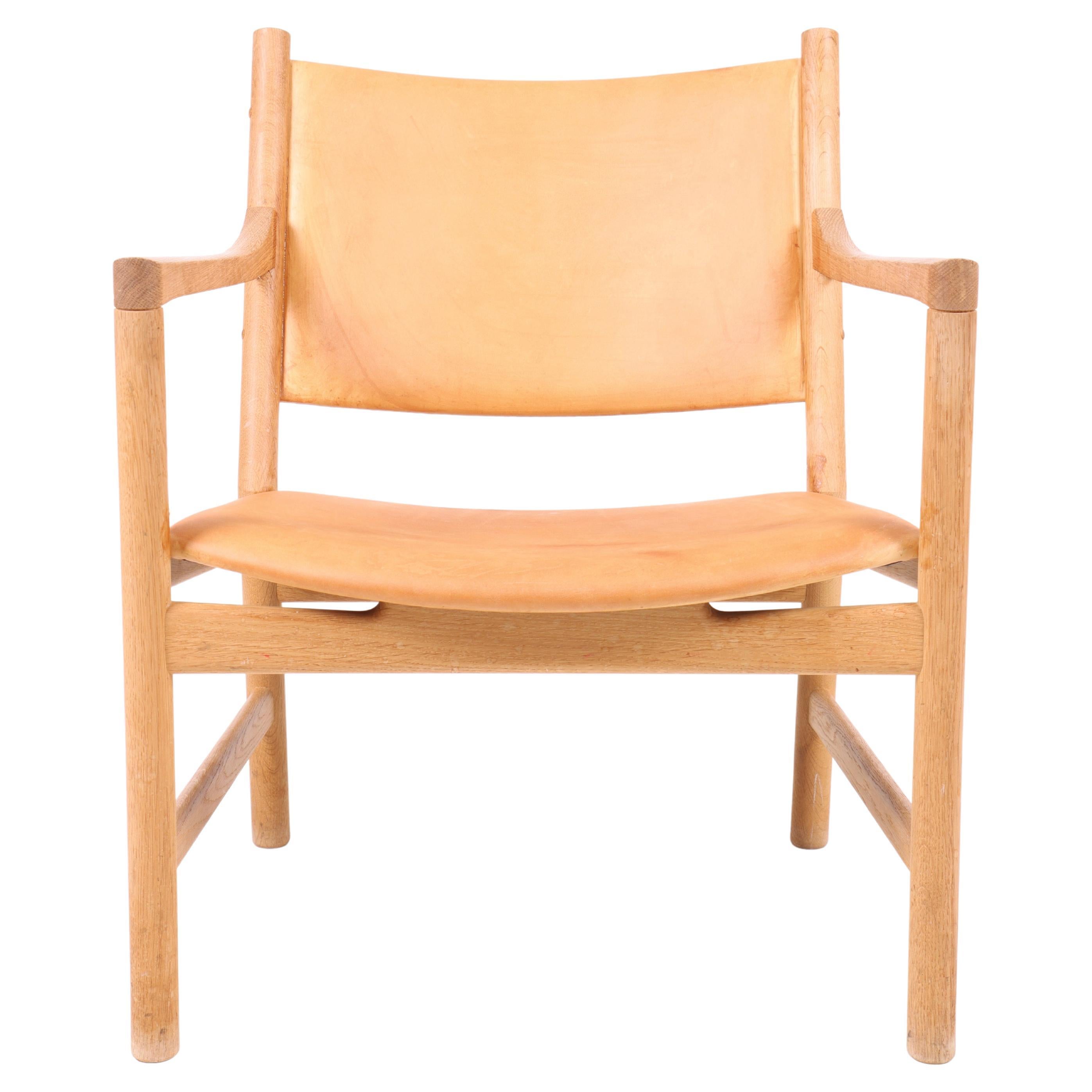 Lounge Chair in Oak and Patinated Leather by Hans Wegner, 1960s