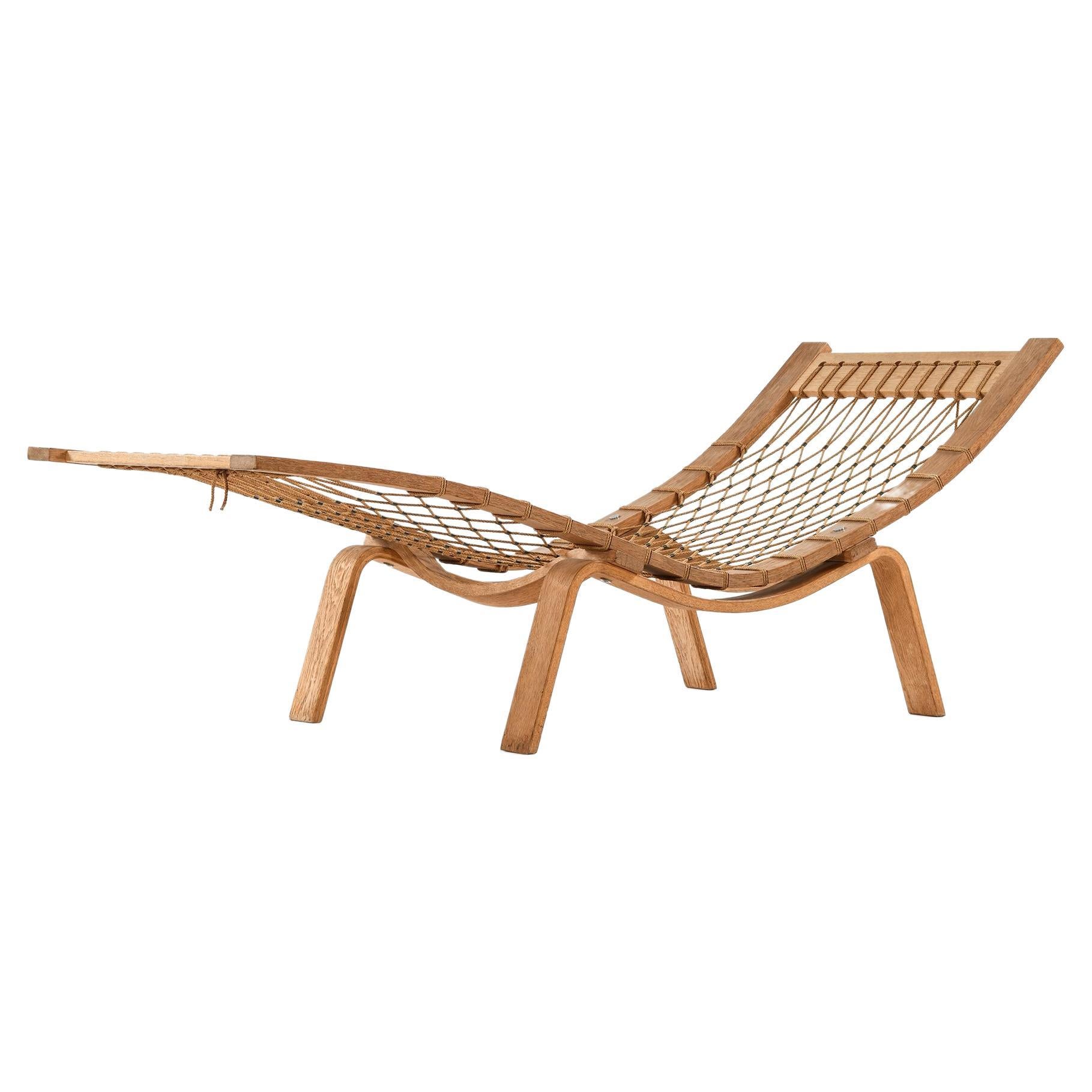 Lounge Chair in Oak and Sheepskin by Hans Wegner, circa 1960s For Sale