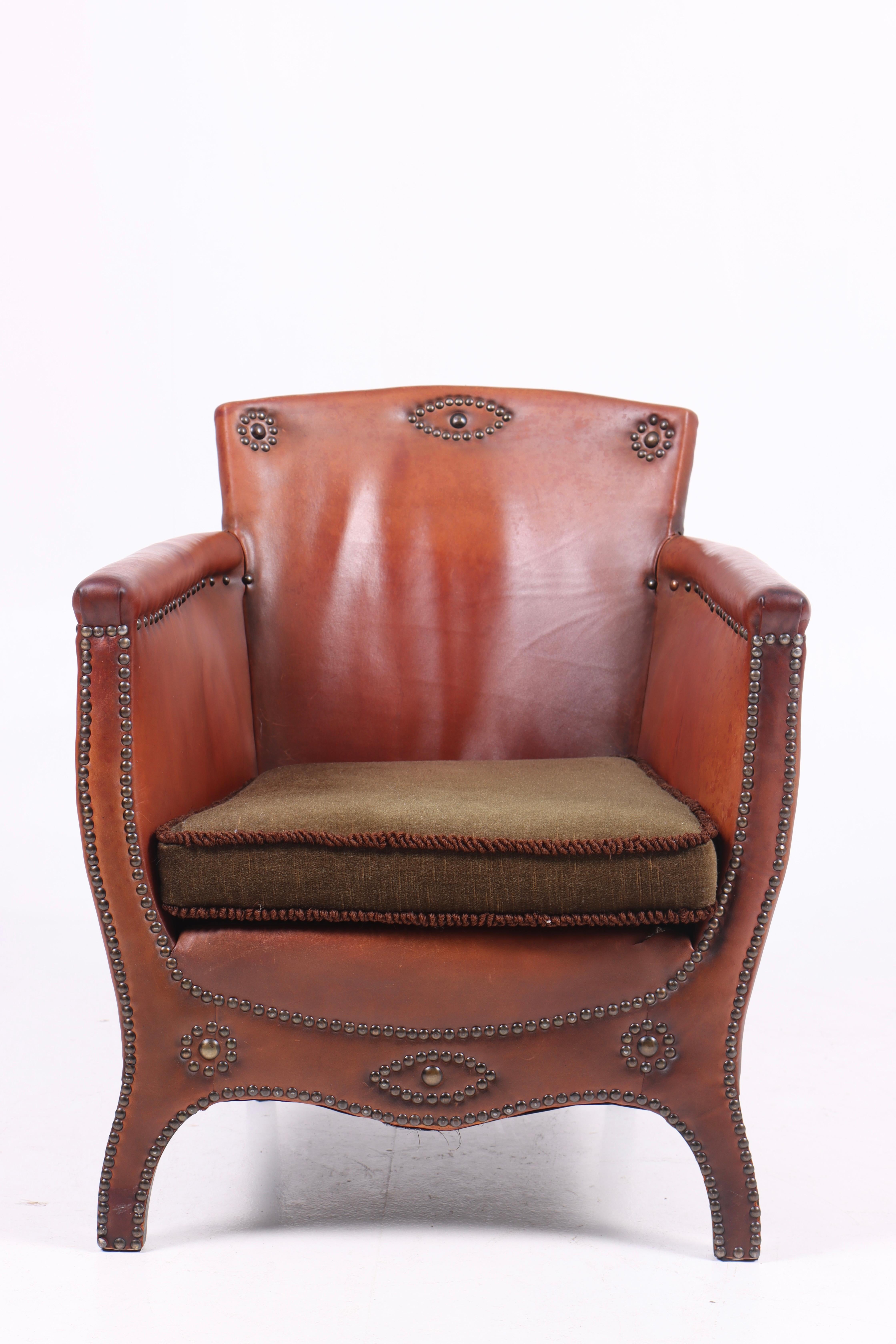 Lounge chair in leather and fabric. Designed by Otto Schulz and made by Boet AB. Original condition.