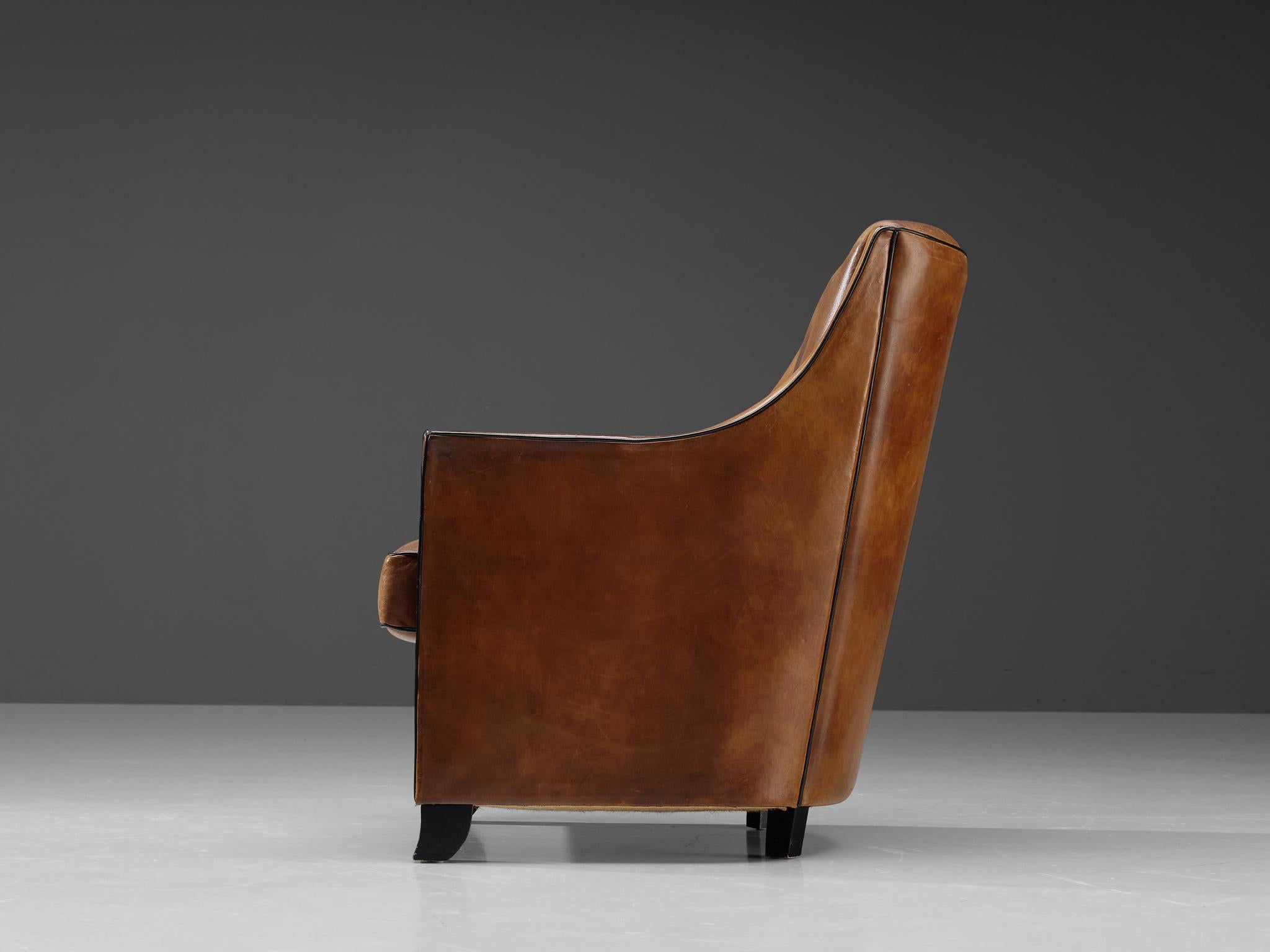 European Lounge Chair in Patinated Brown Leather For Sale