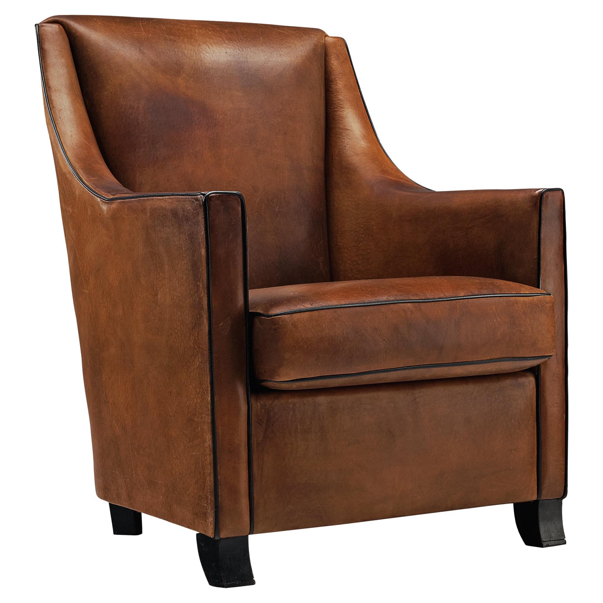 Lounge Chair in Patinated Brown Leather For Sale