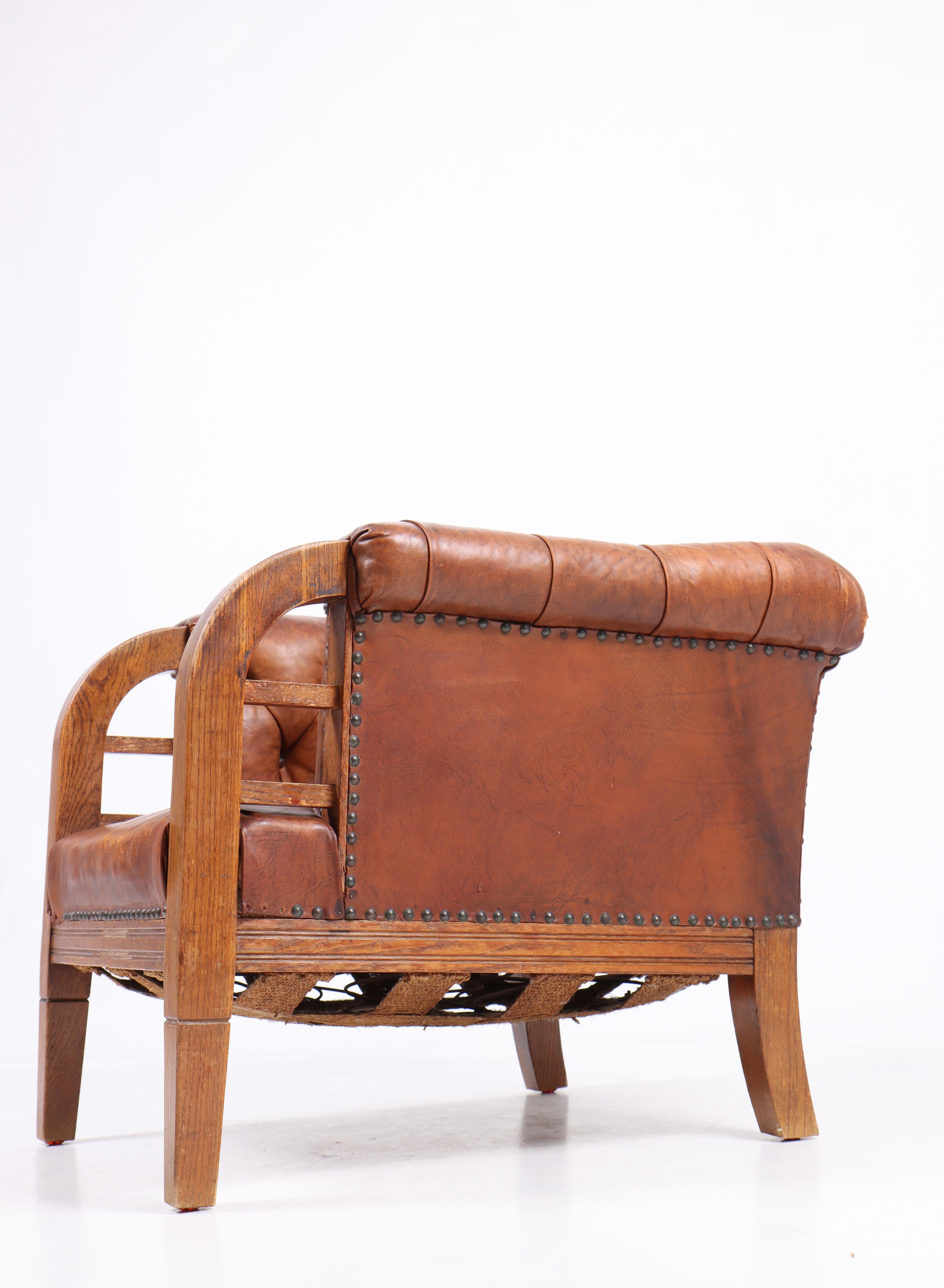 Scandinavian Modern Lounge Chair in Patinated Leather, Made in Denmark, 1940s For Sale