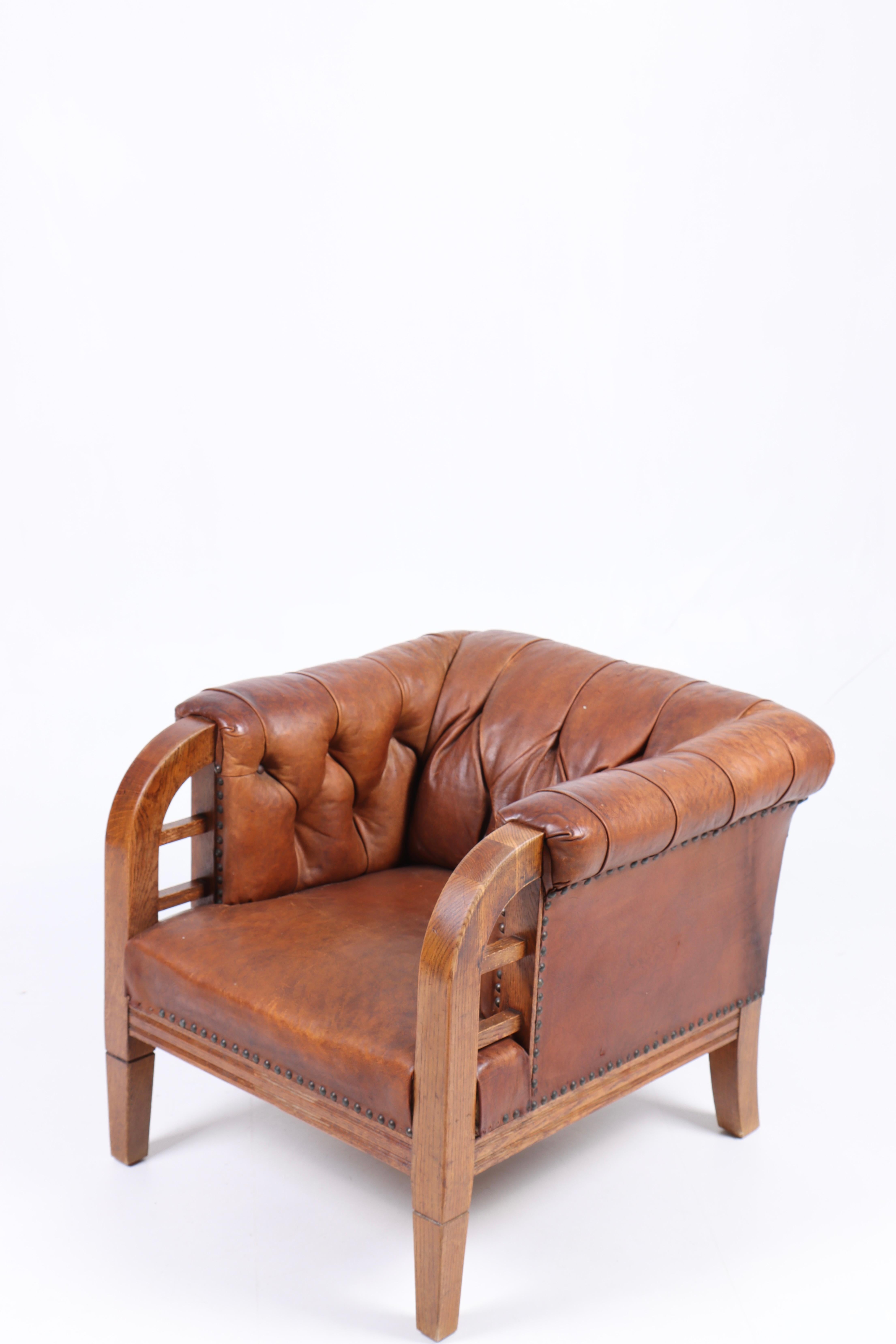 Swedish Lounge Chair in Patinated Leather, Made in Denmark, 1940s For Sale
