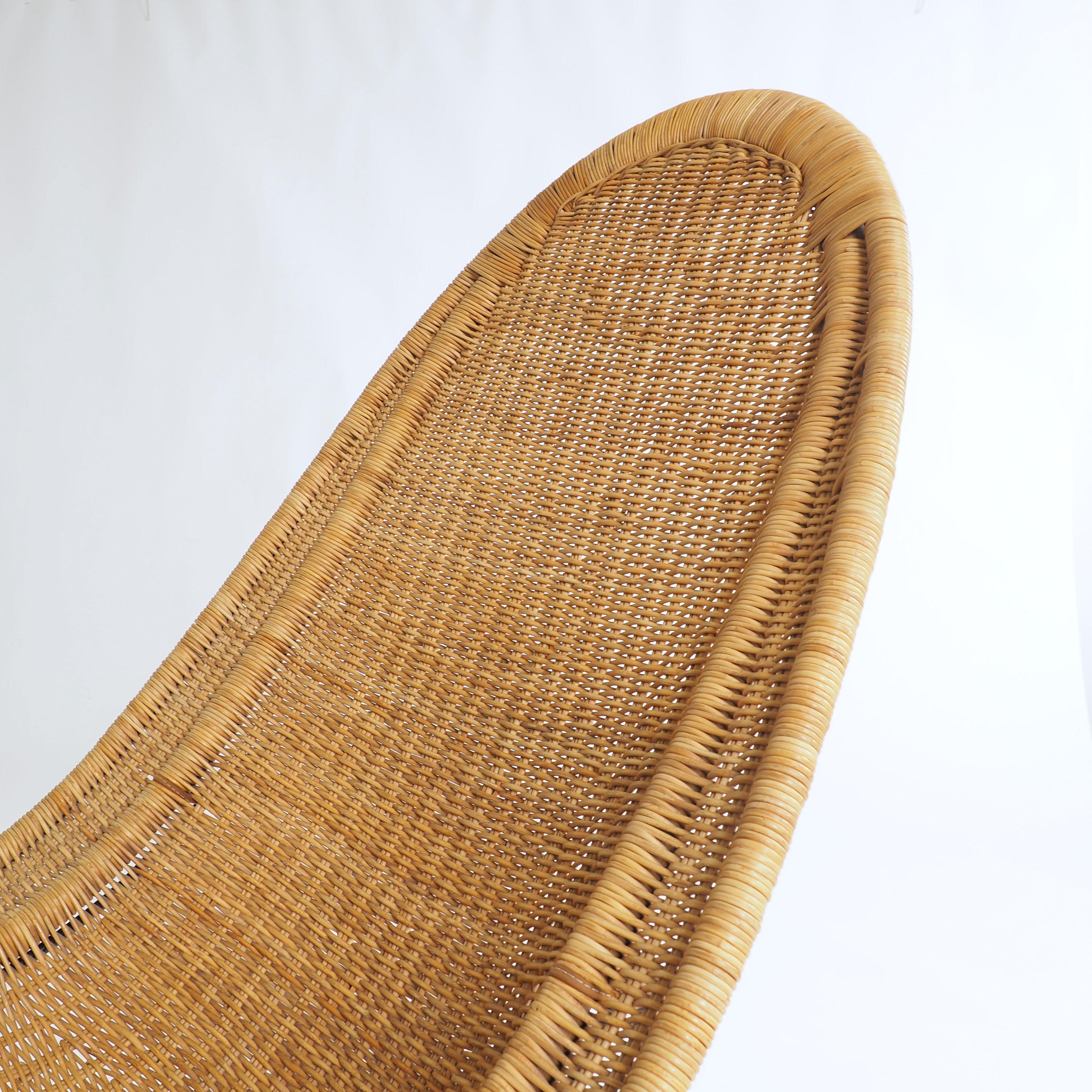 Kerstin Hörlin-Holmqvist designed this lounge chair in rattan and painted metal for the warehouse Nordiska Kompaniet in 1952. She was at that time the most wellknown female furniture designer in Sweden.