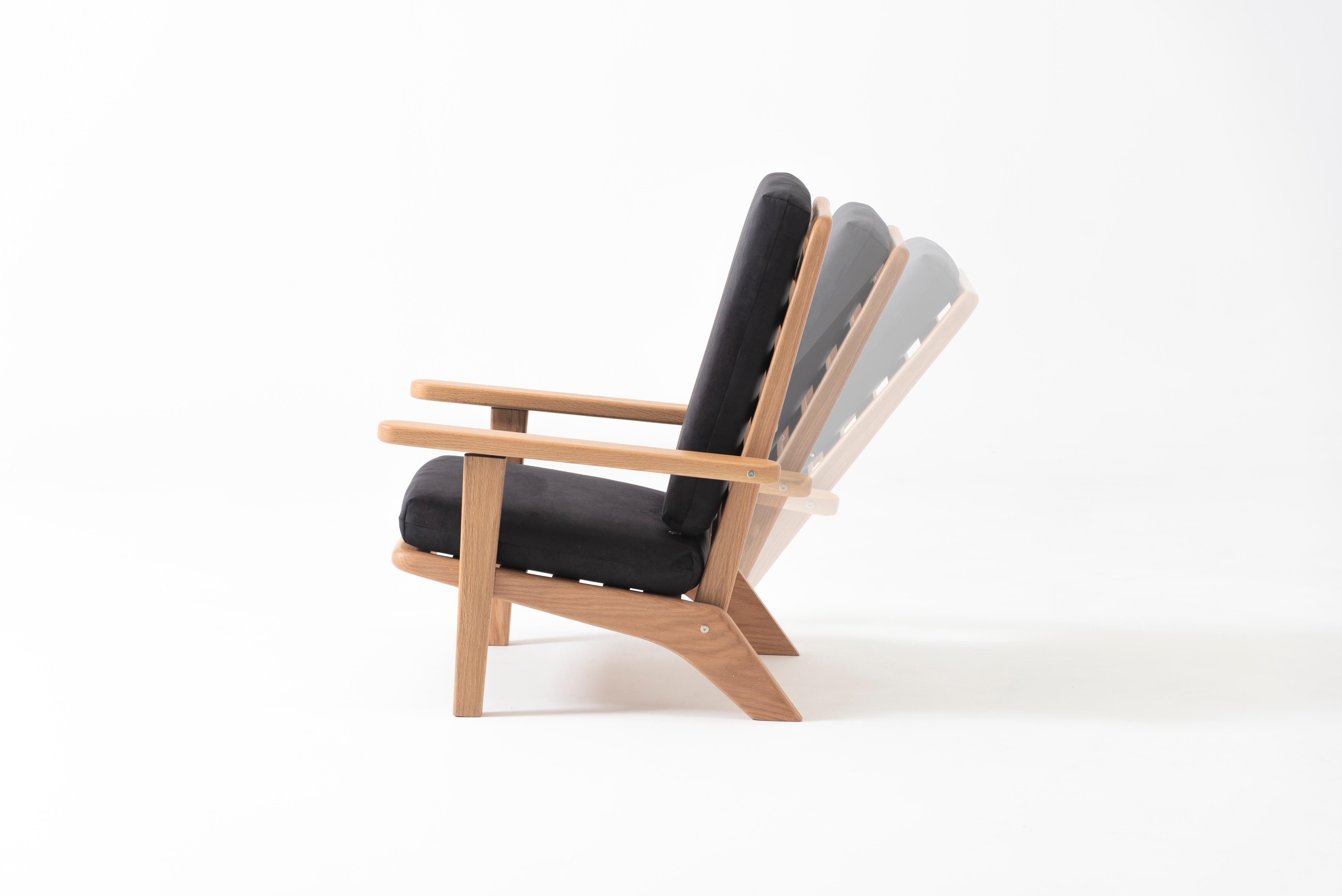 Contemporary Lounge Chair in Solid Oak Wood with Black Textile Cushion and Reclining Backrest For Sale