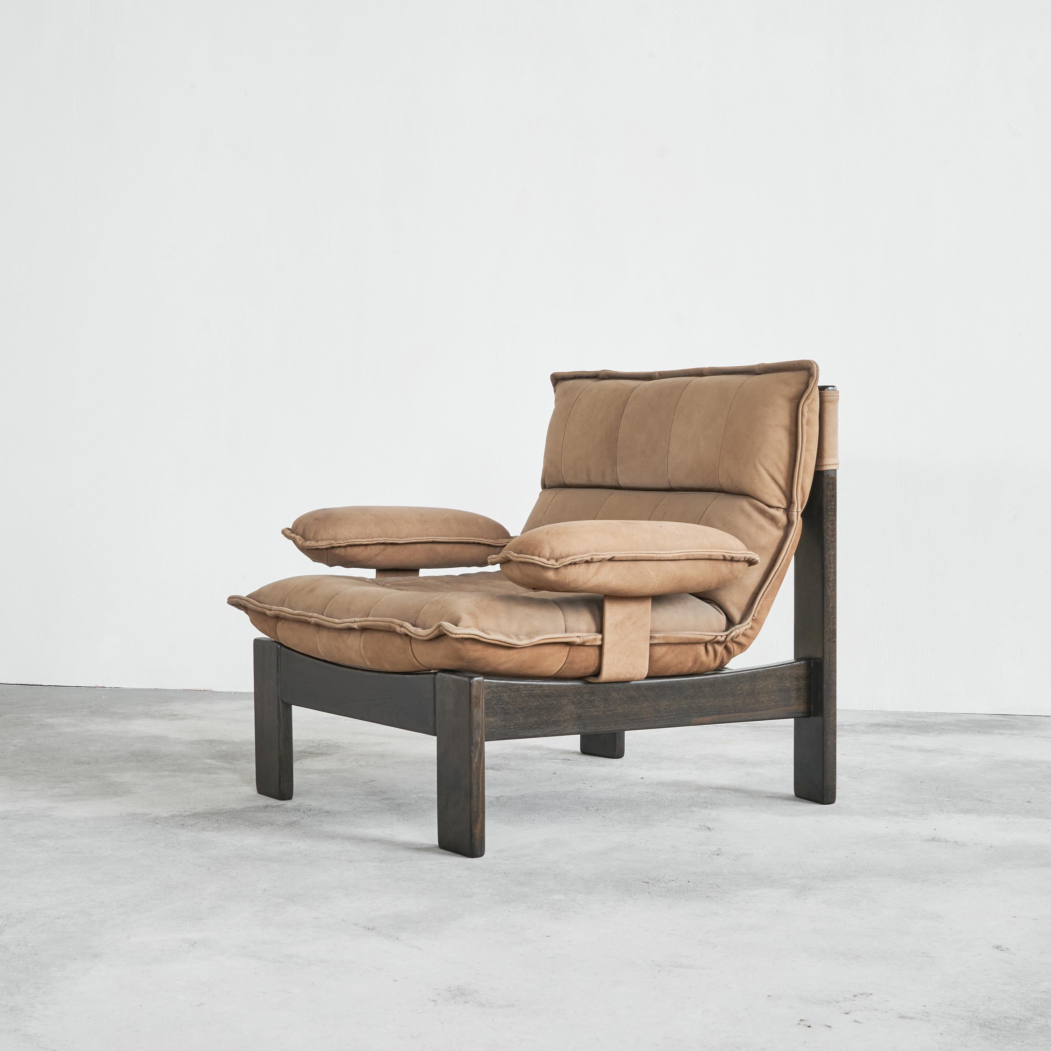 Lounge chair in Suede and stained oak, Europe, 1970s.

This is a very distinct 1970s lounge chair in very beautiful brown suede leather and dark stained oak. Great contrast between the dark stained frame and the luxurious and rich light brown