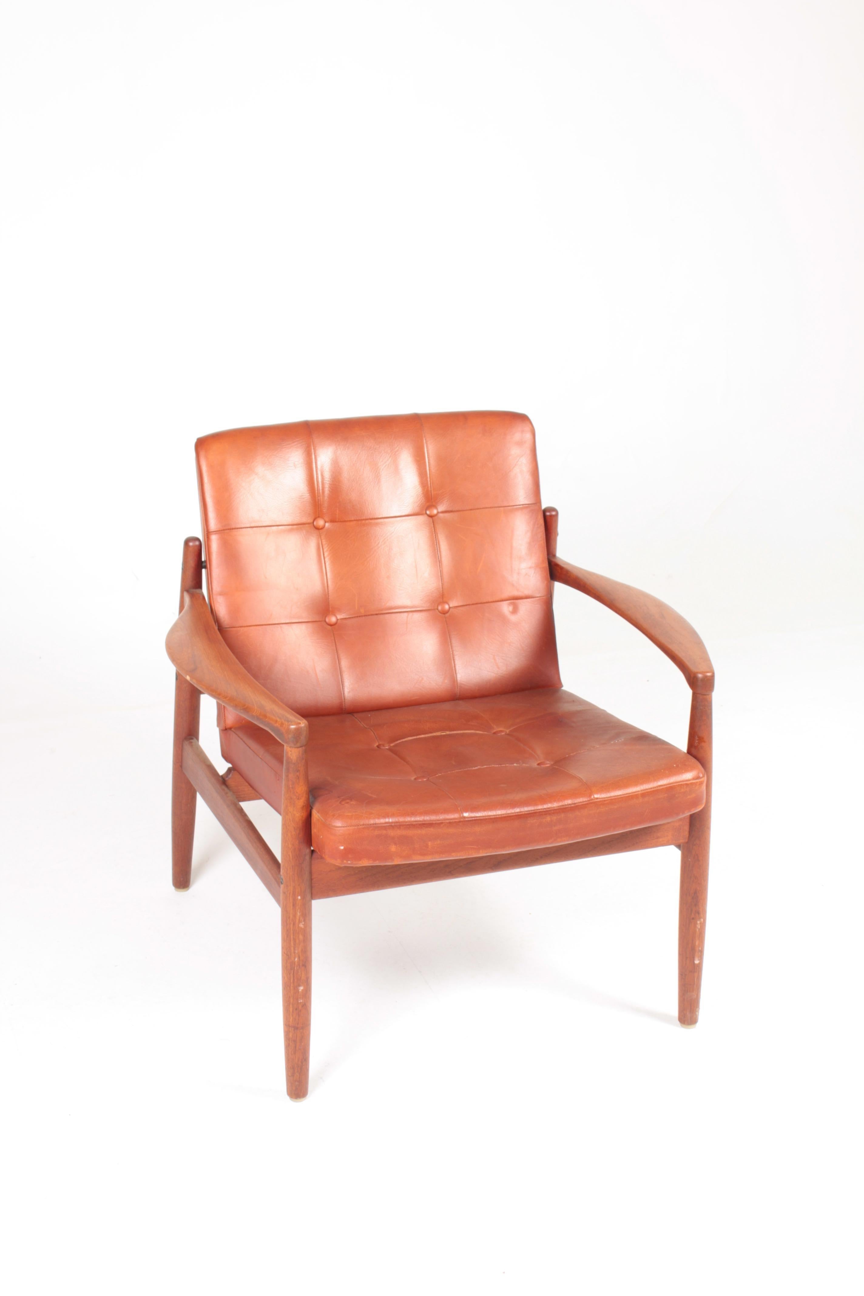 Lounge chair with frame in solid teak and patinated leather seat. Designed by Tove & Edvard Kindt-Larsen for OPE furniture. Made in Sweden. Original condition.