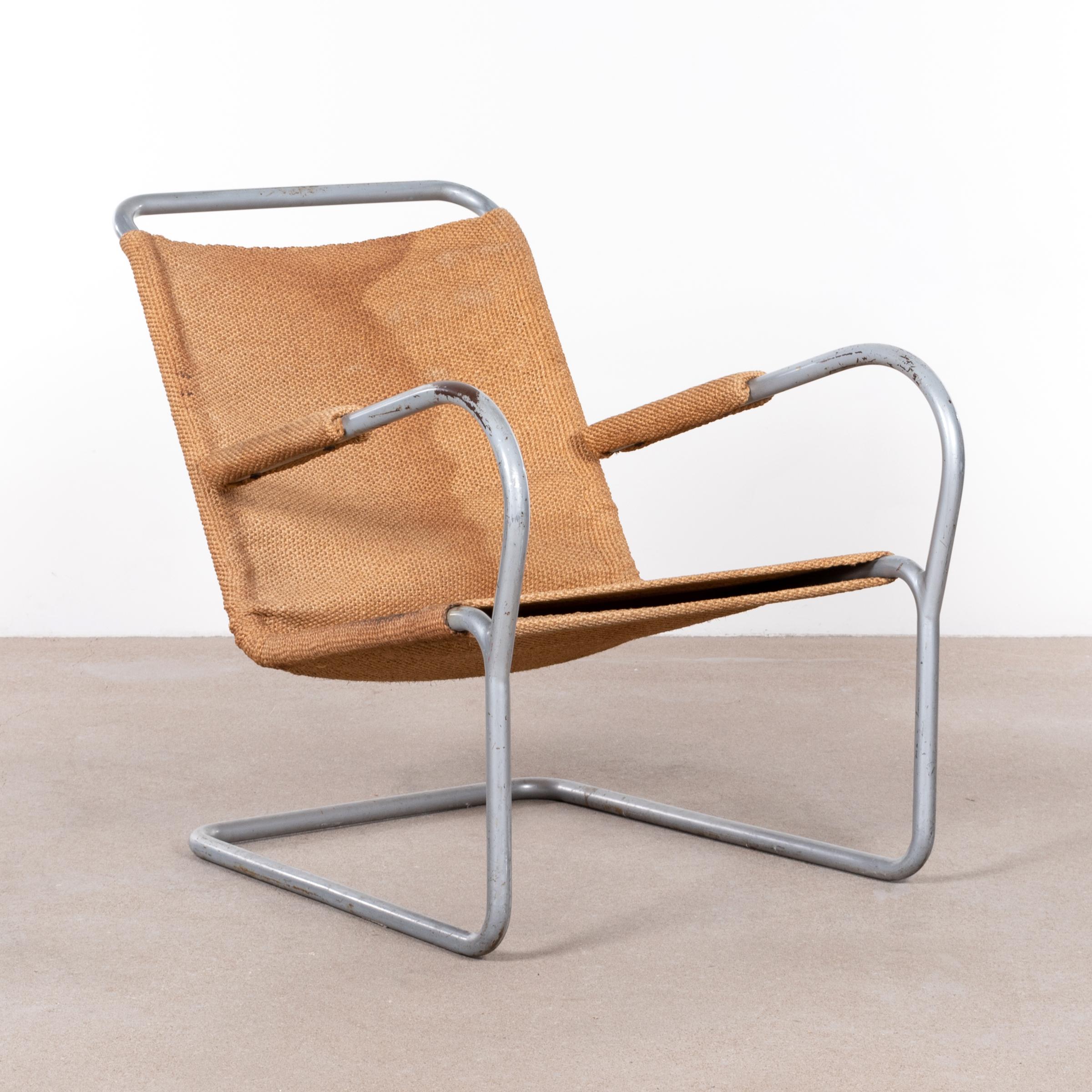 Lounge chair by Bas Van Pelt. Tube steel frame with grey finish and brown burlap upholstery. The lounge chair has a great raw Industrial look and is in used but fair original condition. Rare find!
Chair in collection of Central Museum Utrecht,