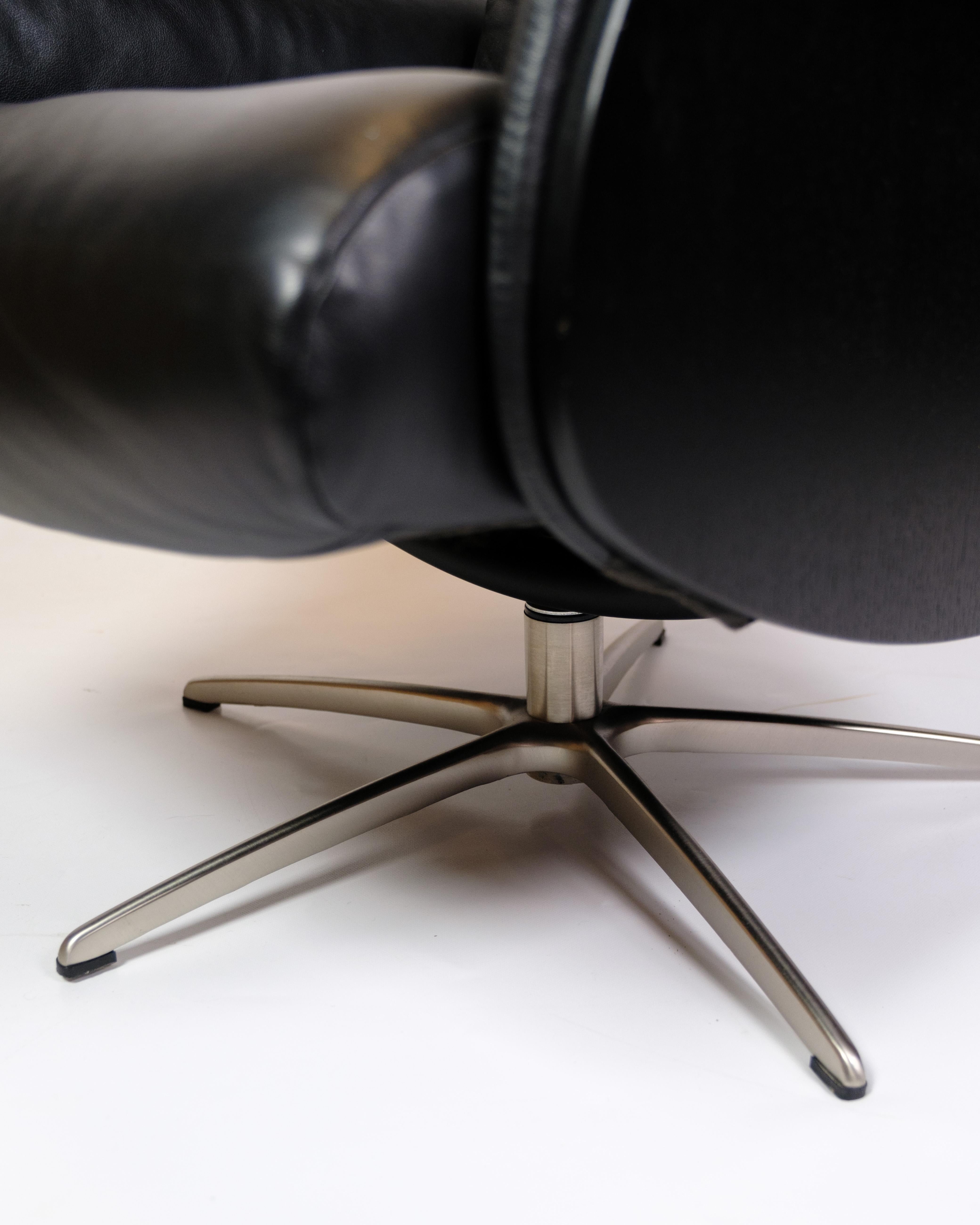 Danish Lounge Chair Made In Black Leather & Aluminum Swivel From 1970s For Sale