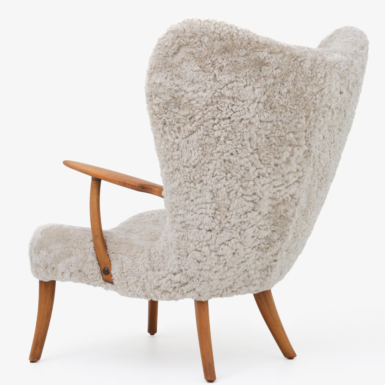 Model 'Pragh' - Reupholstered lounge chair in 'Moonlight' lambswool with patinated beech frame. Designed in 1954. Arnold Madsen & Henry Schubell.