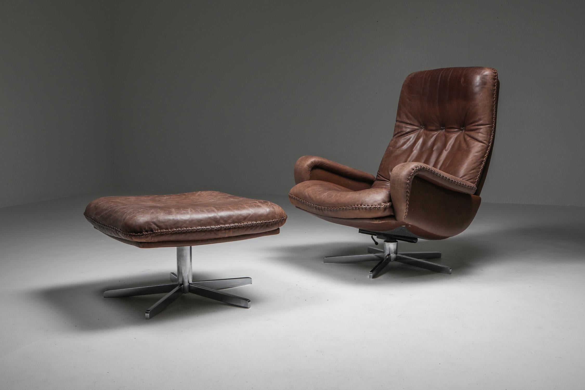 Leather armchairs with ottoman, S231, De Sede, Switzerland, 1969

De Sede S231 is one of the most sought after Classic chairs since it was shown in the James Bond movie in 1969. A timeless design icon made by the Swiss Manufacturer De Sede which