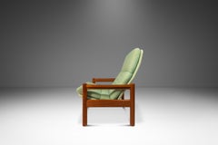 Silla de salón con otomana a juego en teca de Domino Møbler, Dinamarca, c. 1970