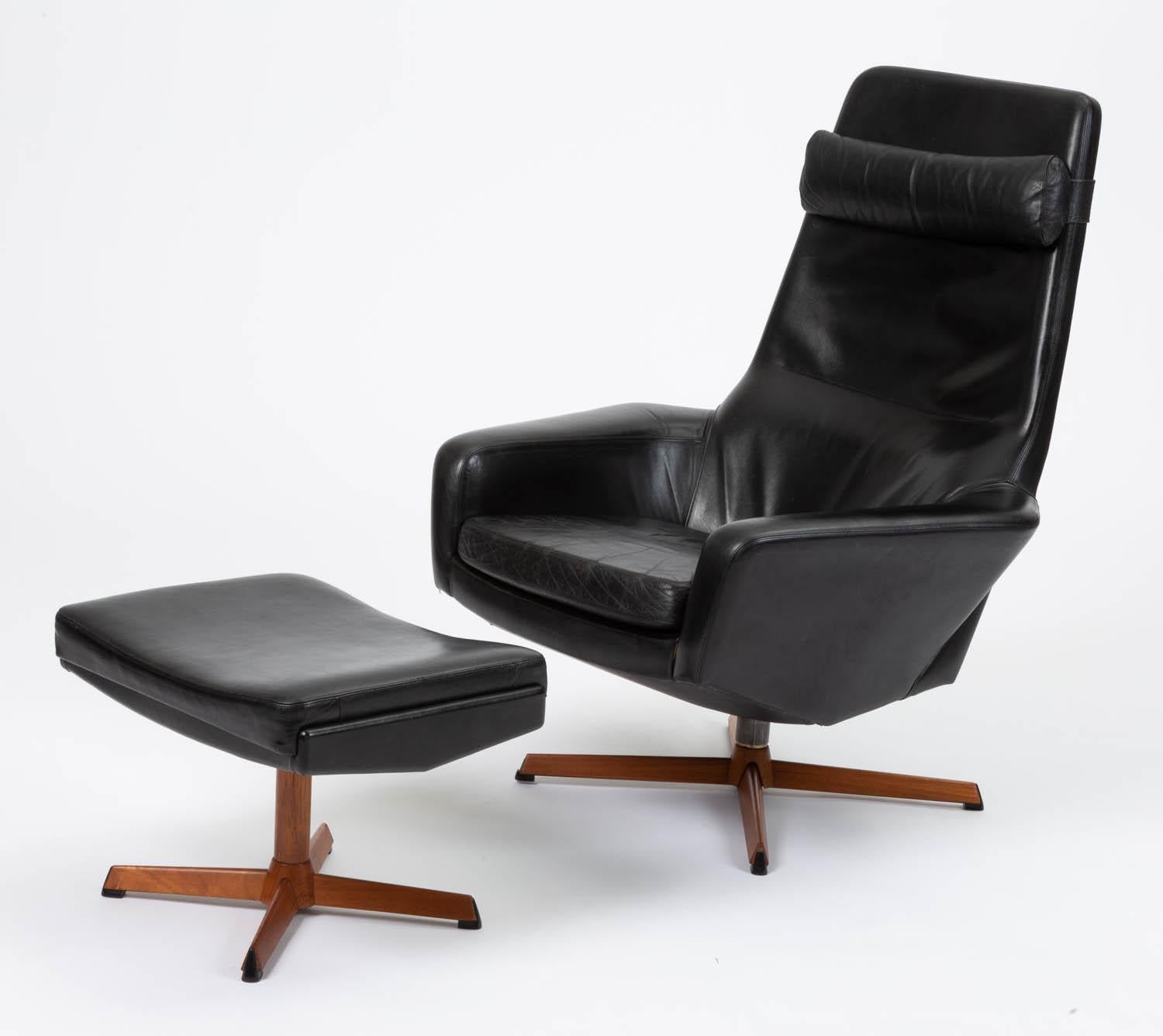 Lounge chair with ottoman by Ib Madsen & Acton Schübell for their brand Madsen & Schübell, Denmark, circa 1950s. The chair and ottoman retain original black leather upholstery and feature multiple settings for comfortable angle adjustments. There is