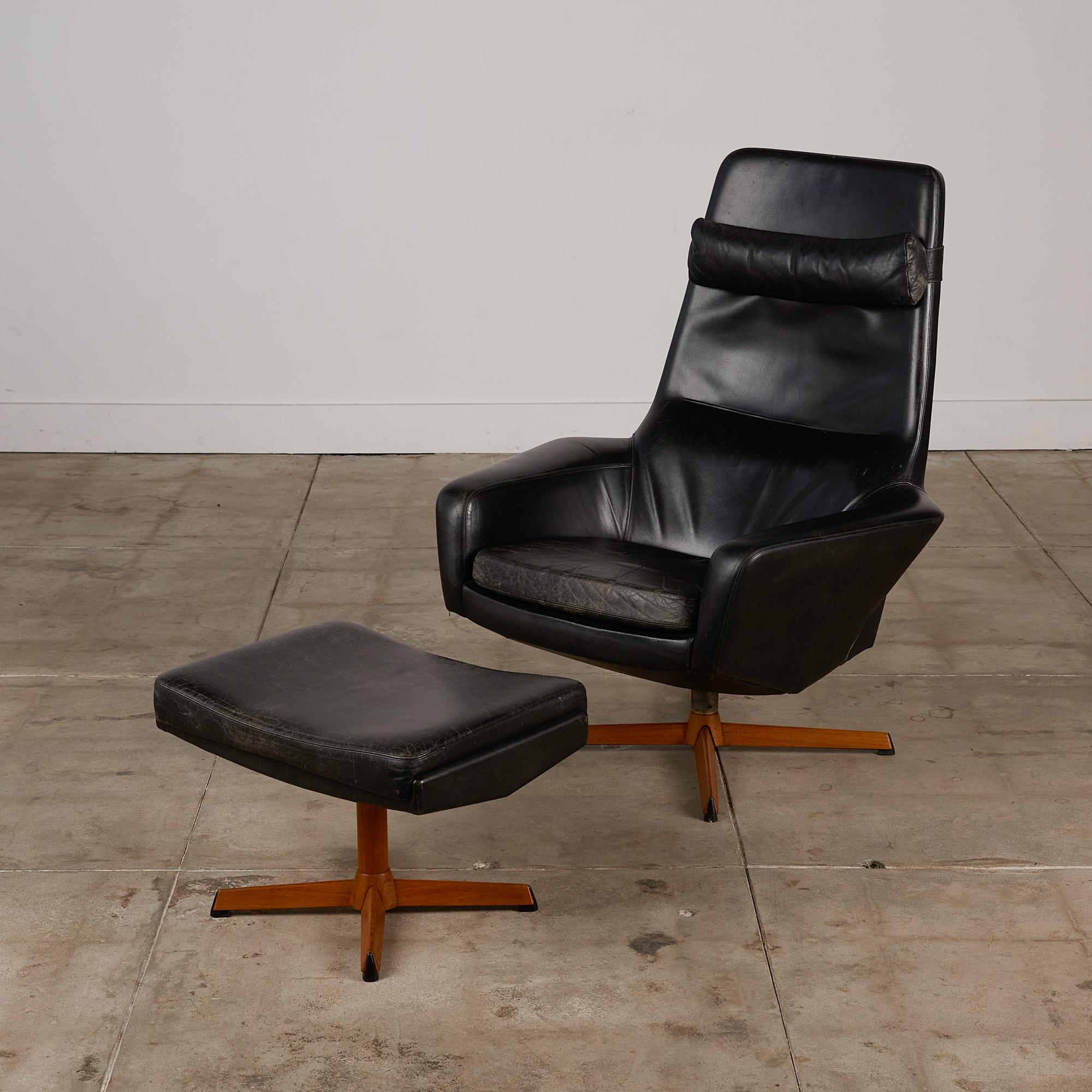 Lounge chair with ottoman by Ib Madsen for Madsen & Schübell, Denmark, circa 1950s. The chair and ottoman retain original black leather upholstery and feature multiple settings for comfortable angle adjustments. There is a detachable neck pillow
