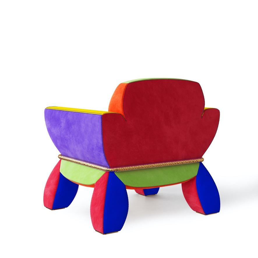 Lounge chair upholstered in multicoloured suede with solid brass details from Troy Smith Studio.

Handcrafted and made to order the X-tra Chubby lounge chair is a sight to behold. Unmistakable in quality, style and outright fun. This chair is sure
