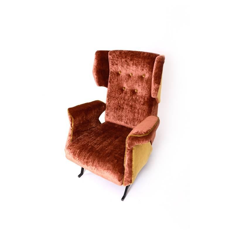 Large Italian lounge chair on iron legs with a cushioned seat, arm- and backrest. The lounge chair was reupholstered with a high-quality soft fabric in copper and gold.