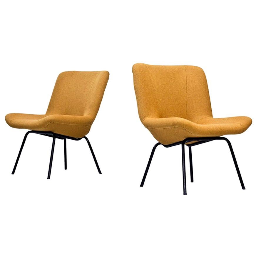 Rare pair of Scandinavian Modern “Lehti” (leaf) easy chairs designed by Carl Gustaf Hiort af Ornäs, manufactured by Puunveisto Oy - Träsnideri in Finland during the 1950s. Black lacquered tubular steel base. Newly upholstered with Vidar 3 / 0472