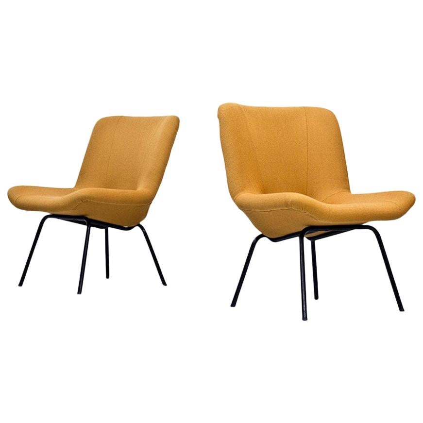 Rare pair of Scandinavian Modern easy chairs, model “Lehti” (leaf) designed by Carl Gustaf Hiort af Ornäs, manufactured by Puunveisto Oy - Träsnideri in Finland during the 1950s. 
Black lacquered tubular steel base. Newly upholstered with Vidar 3 /