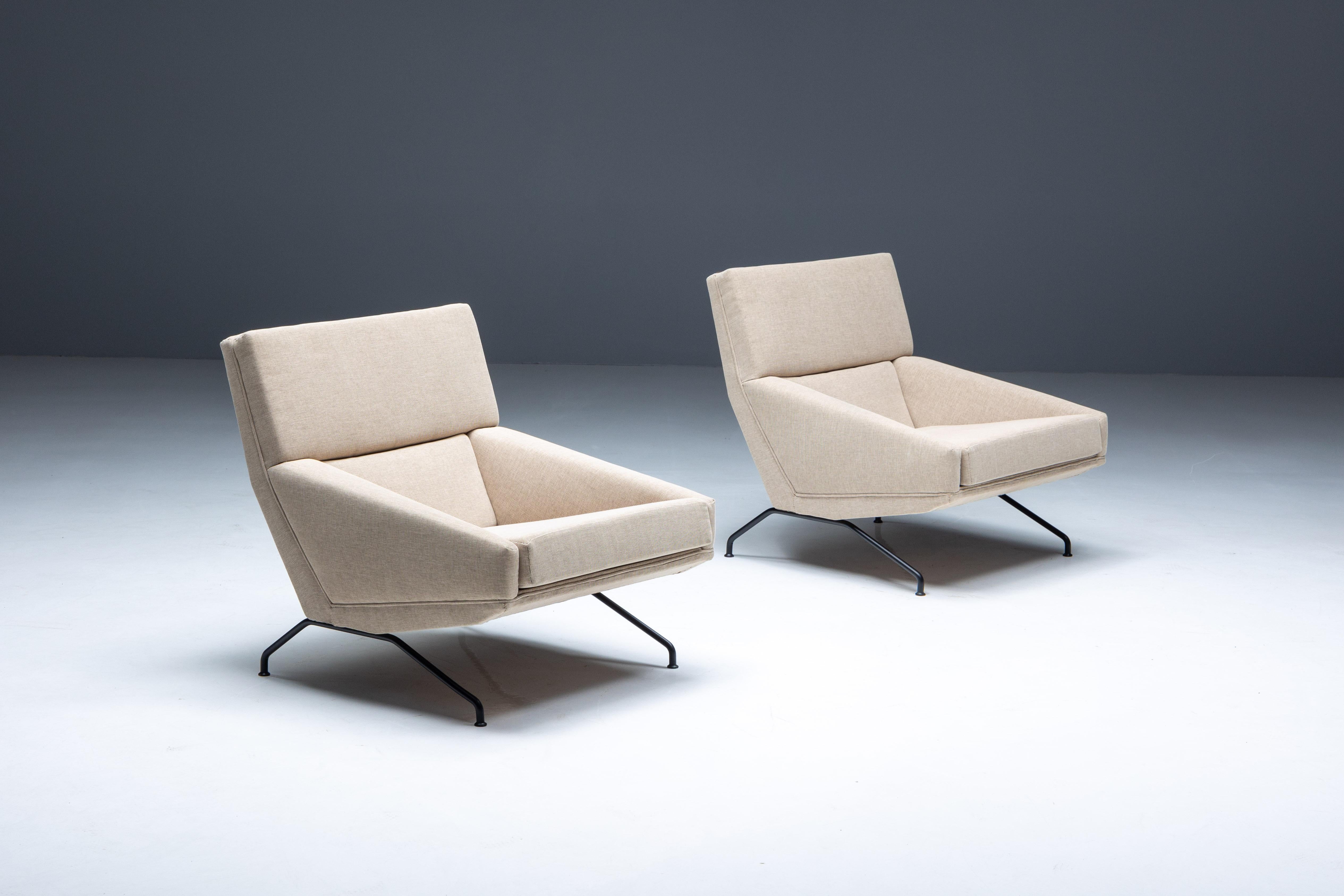 Lounge chairs designed by Georges van Rijck and manufactured by Beaufort in Belgium. These armchairs merge the timeless design aesthetics of 1960s Belgium with contemporary elegance. Adorned with premium fabric upholstery, they exude sophistication,