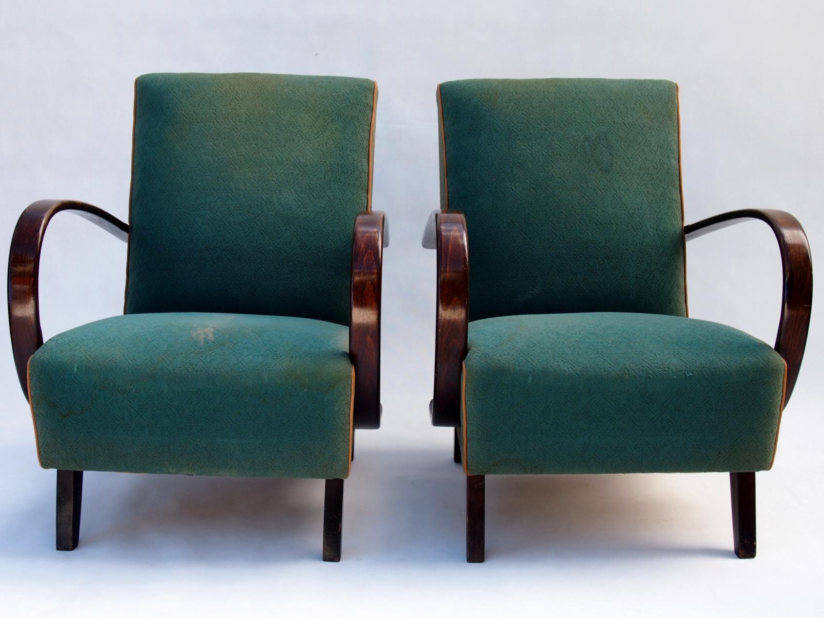 This lounge chairs, model No. 2, were designed by Jindrich Halabala and produced in former Czechoslovakia in the 1930s by UP Zavody Brno. The chairs features curved armrests and legs made from stained beech and are upholstered in original fabric.