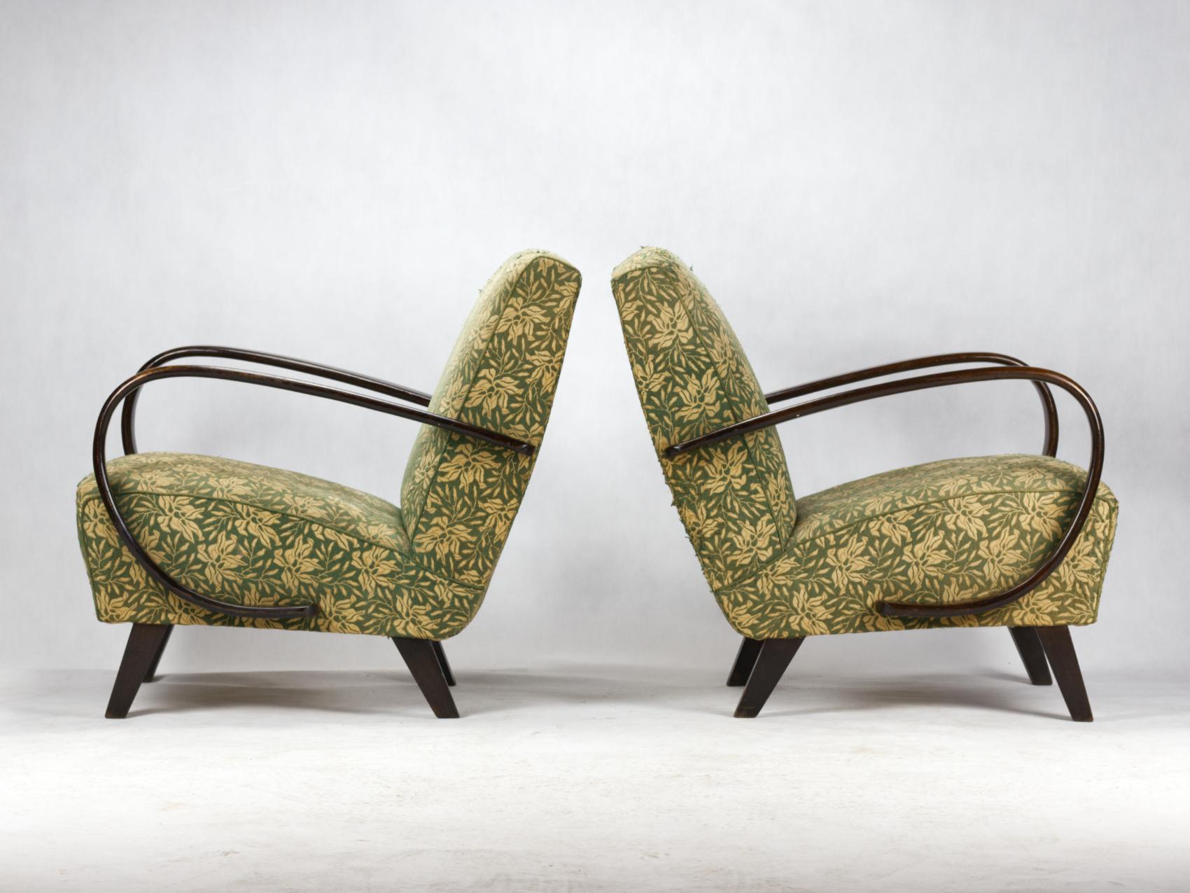 This lounge chairs, model no. 2, were designed by Jindrich Halabala and produced in Czechoslovakia in the 1930s by UP Zavody Brno. The chairs curved armrests and legs made from stained beech and chairs are upholstered in original fabric. The chairs