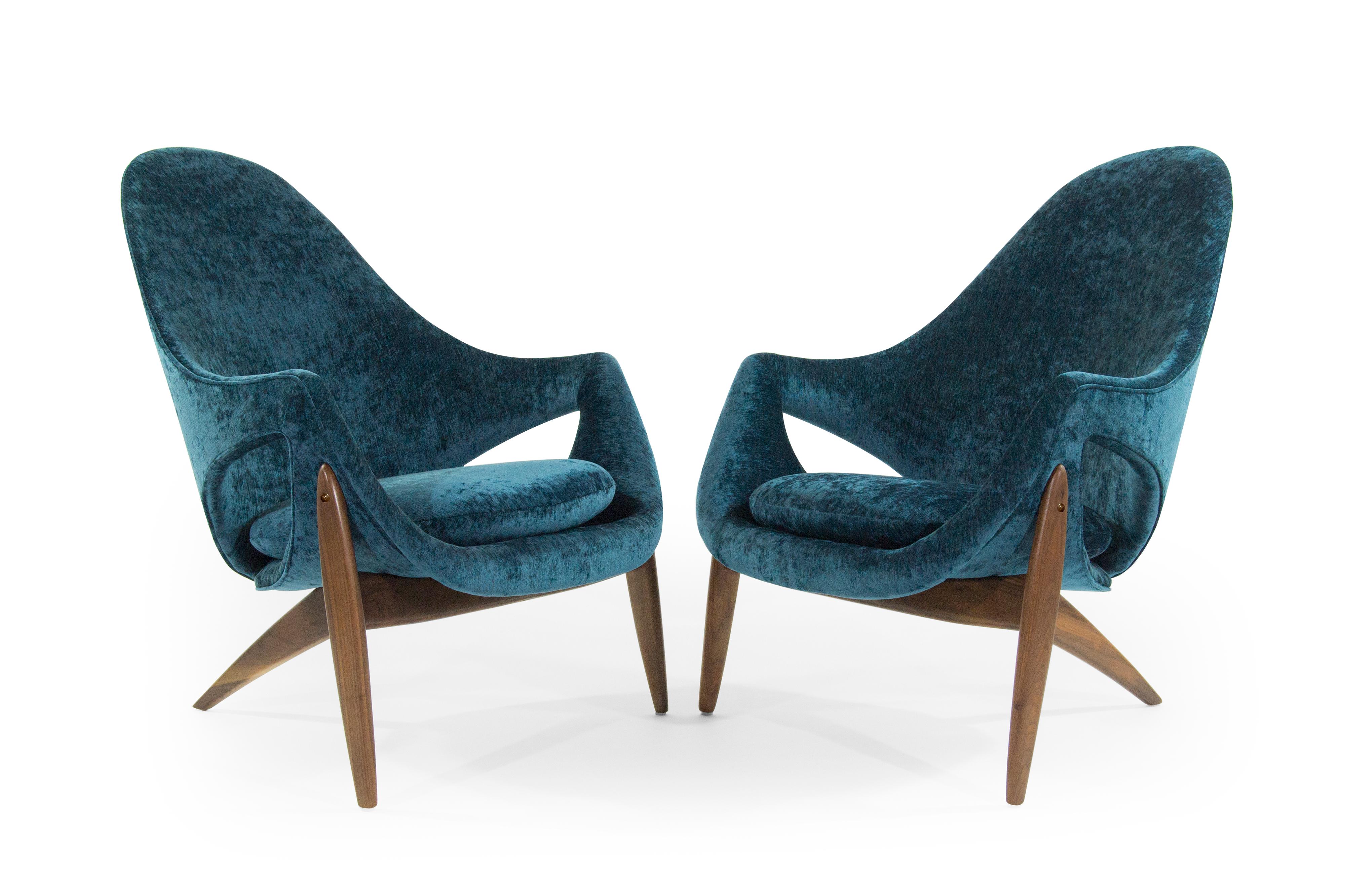 Rare set of chairs designed by Italy born furniture designer Luigi Tiengo and produced by the Canadian manufacturer Cimon in 1963. Sculptural shape featuring three-legged fully restored walnut bases, newly upholstered in blue chenille. Striking from