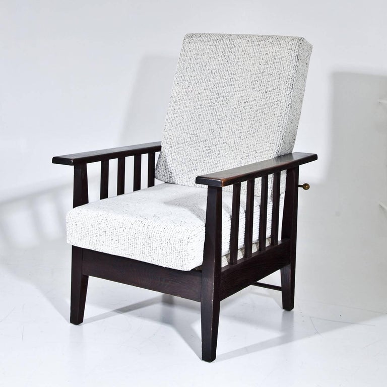Pair of lounge chairs with adjustable backrests and straight armrests with bars. The thick cushions were reupholstered with a structured white and black fabric.